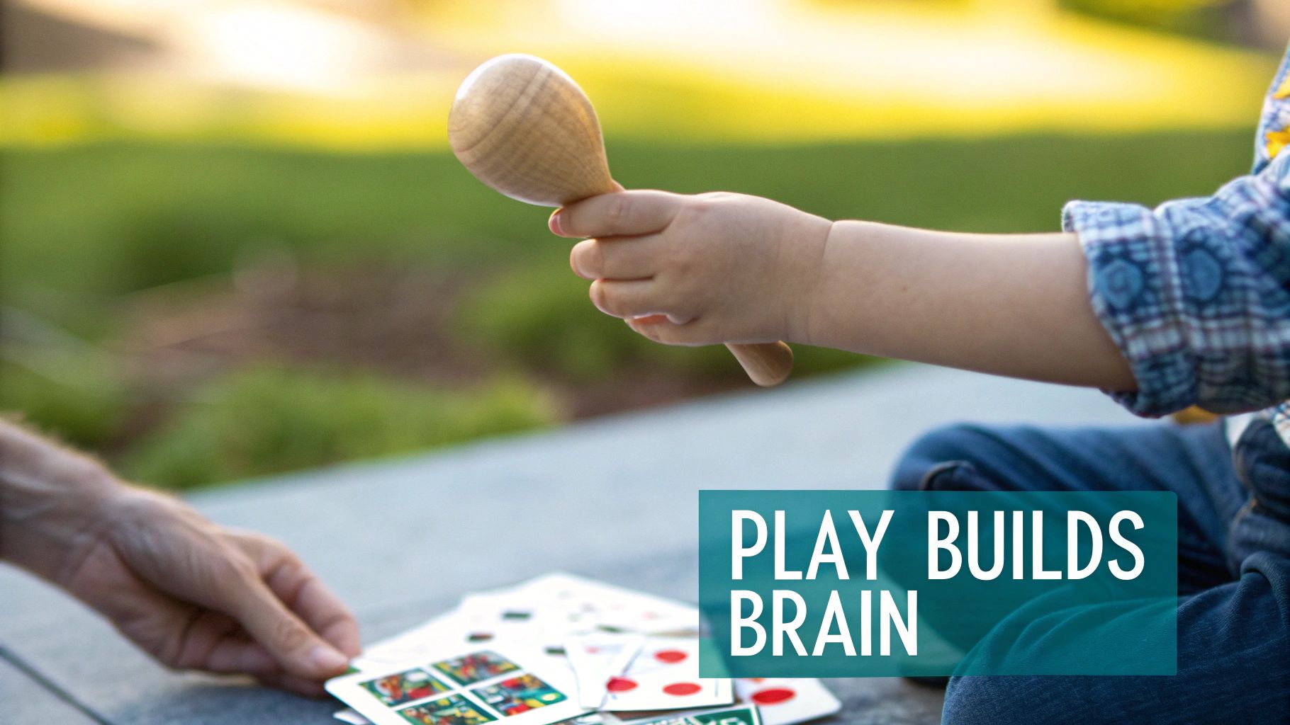 A newborn baby playing with high-contrast, sensory development toys in a play gym.