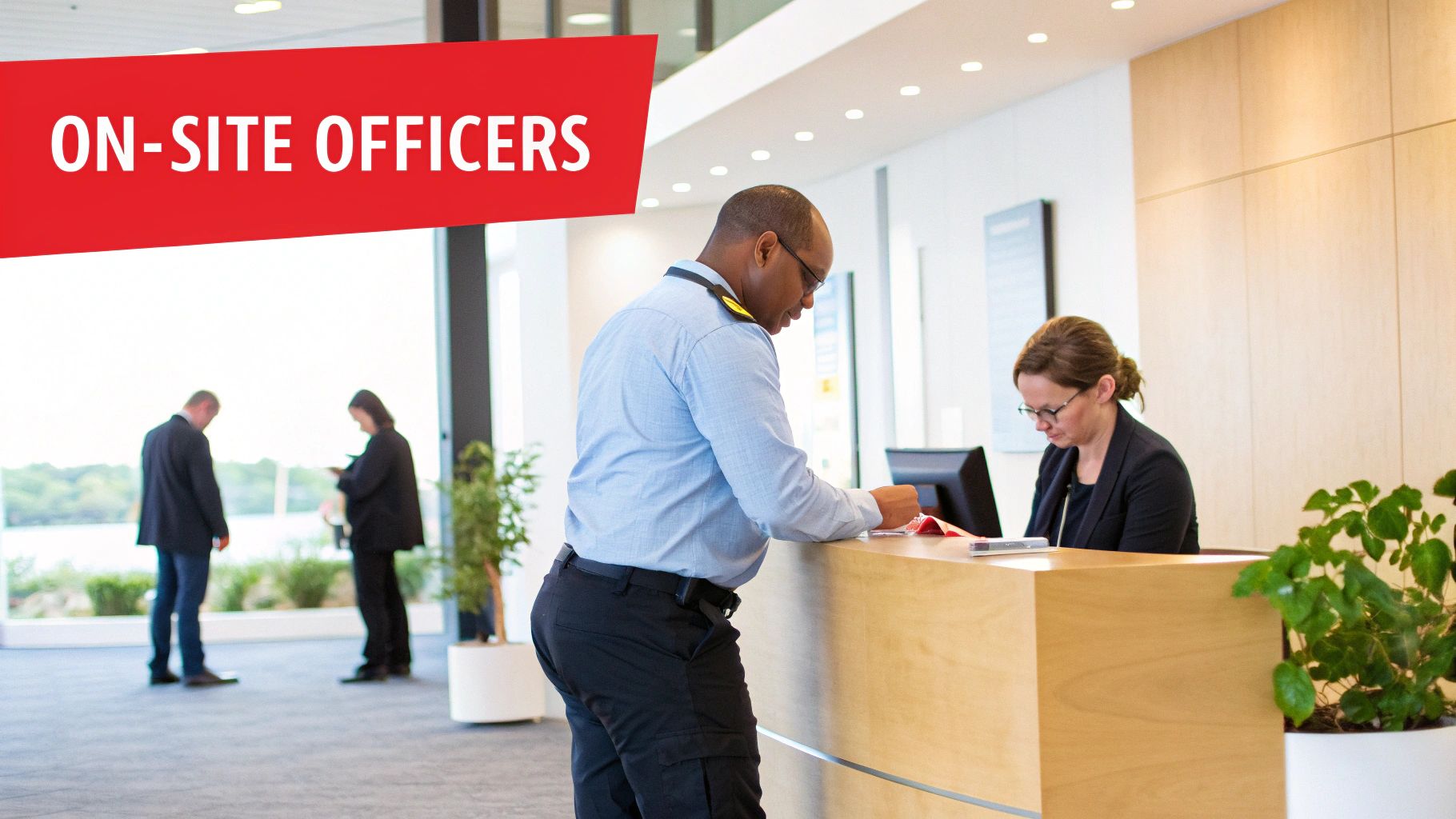 A professional on-site security officer standing in a modern building lobby
