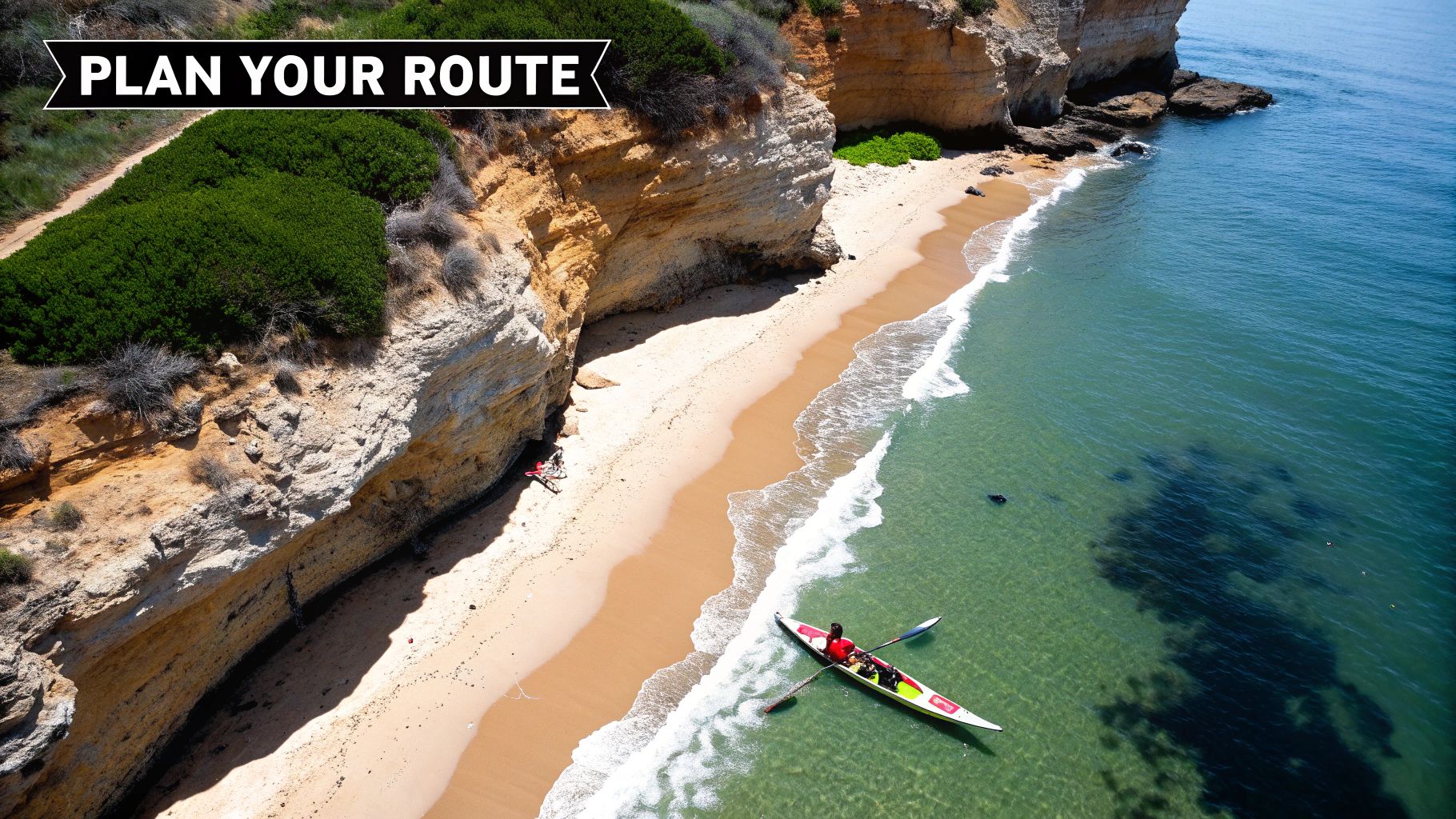 Wide-angle view of the Algarve coastline with golden cliffs and calm turquoise water, representing the route to Benagil Cave