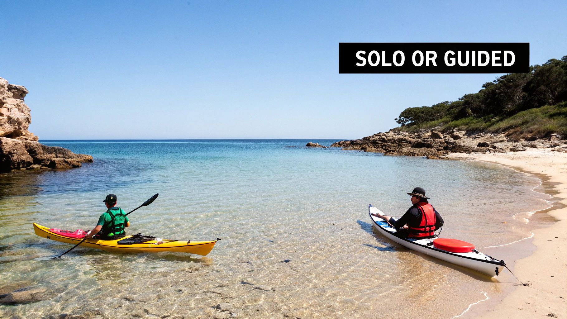 Two people kayaking on the calm ocean near the golden cliffs of the Algarve