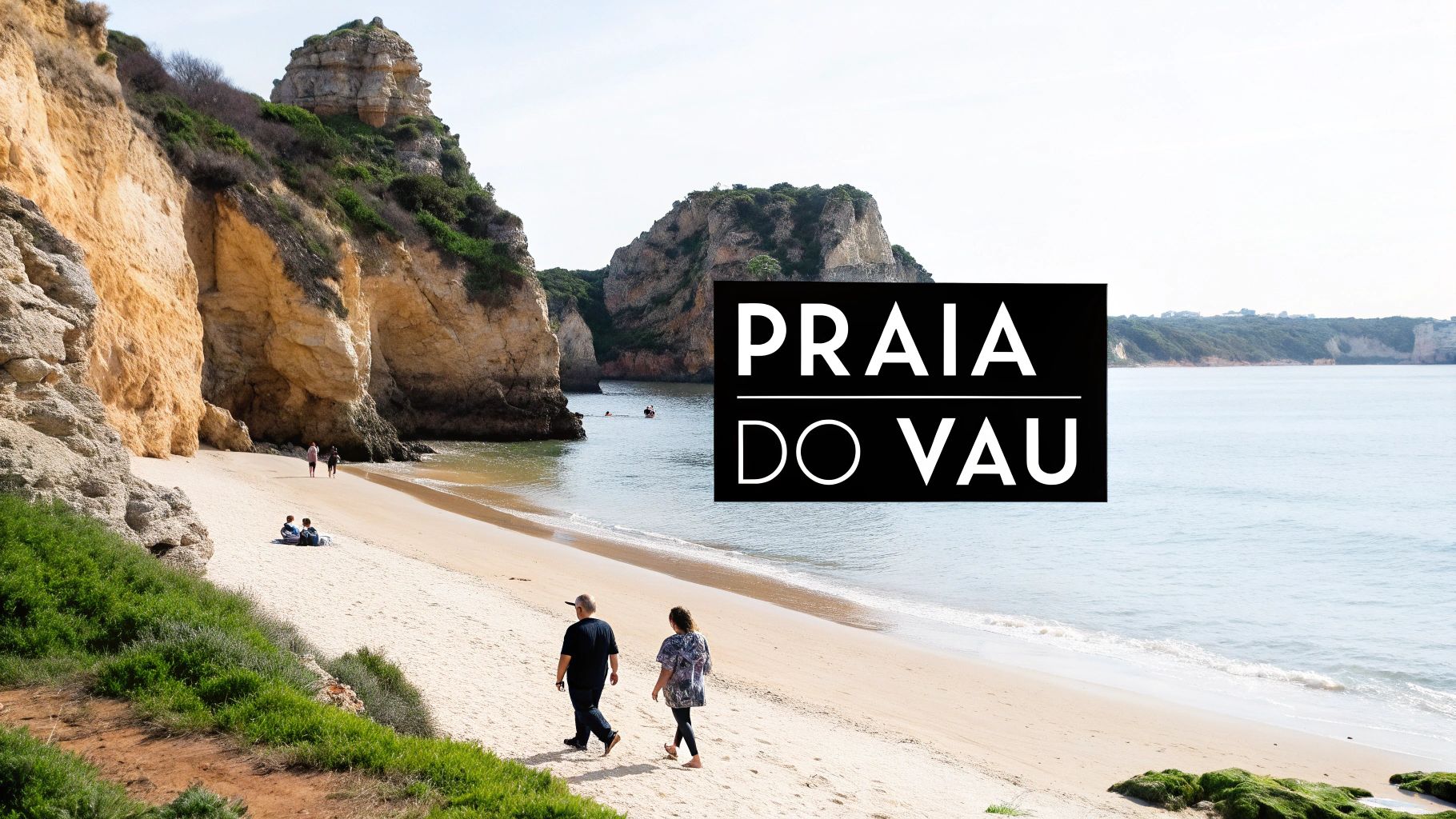 People enjoy the sandy beach and clear waters surrounded by impressive golden cliffs at Praia do Vau.