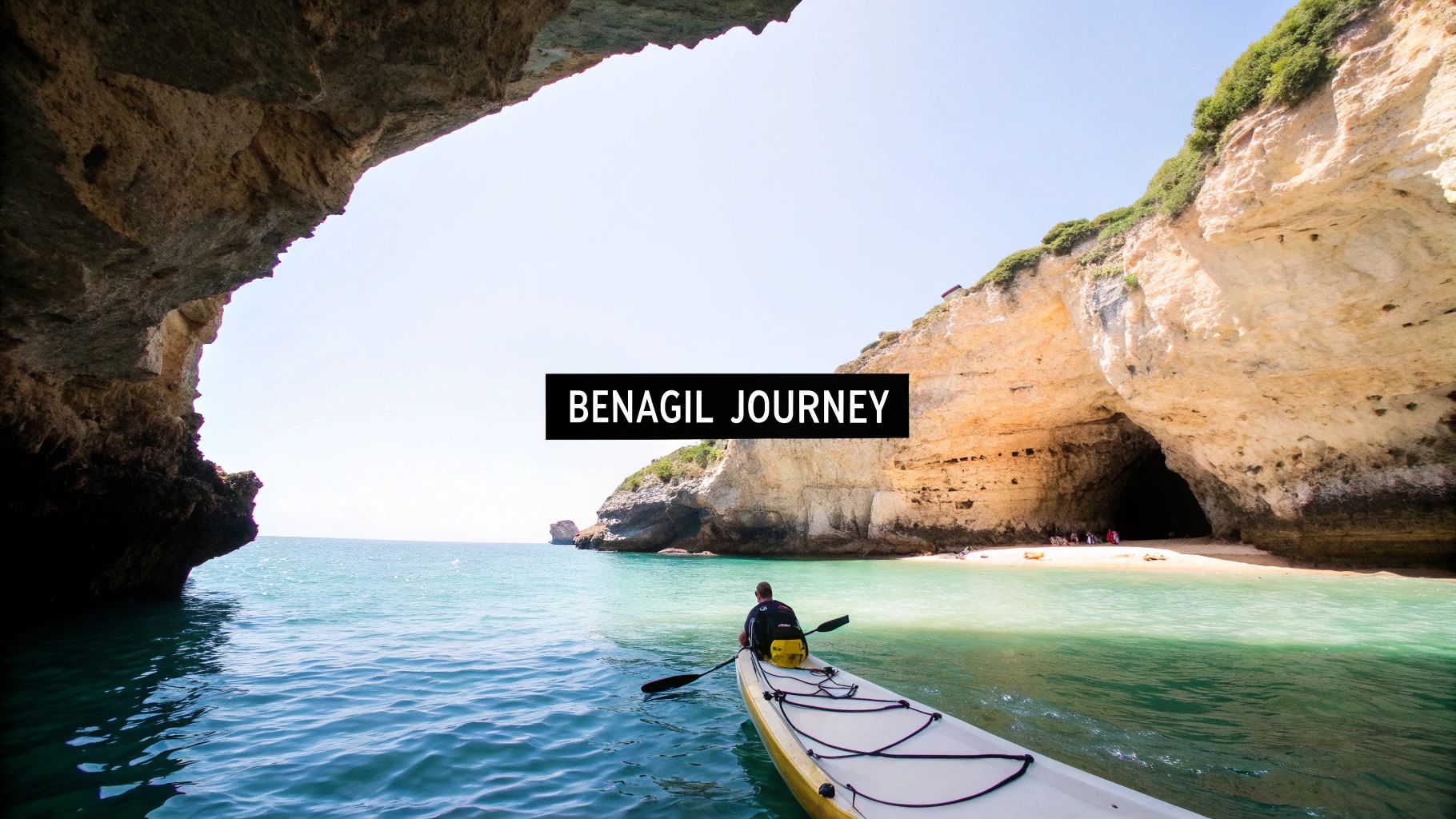 Kayaks lined up on the sand inside the iconic Benagil Cave, with sunlight streaming through the 'eye' in the ceiling