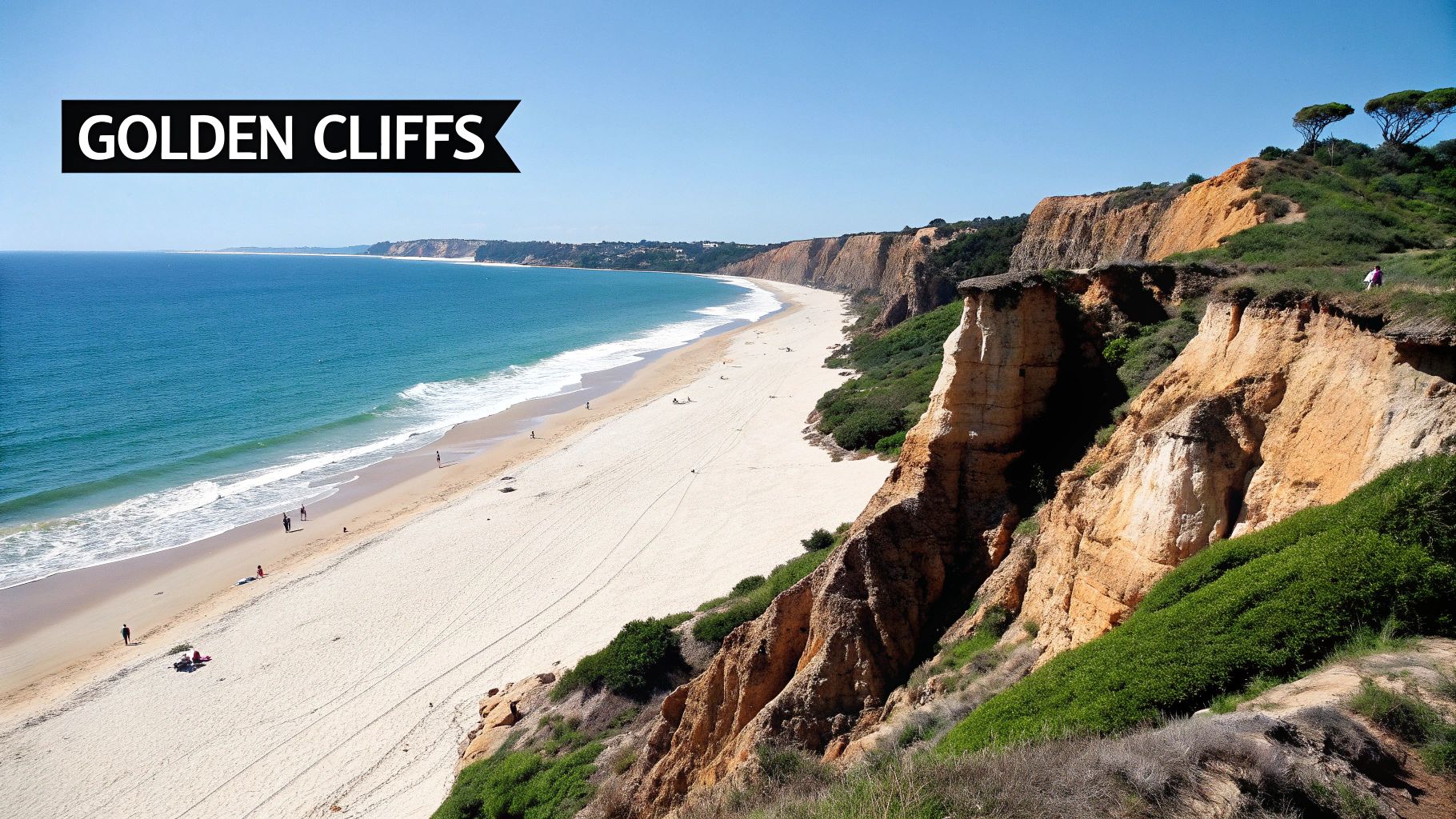 Panoramic view of a stunning golden-orange cliffed beach, with blue ocean waves and people walking on the sand.