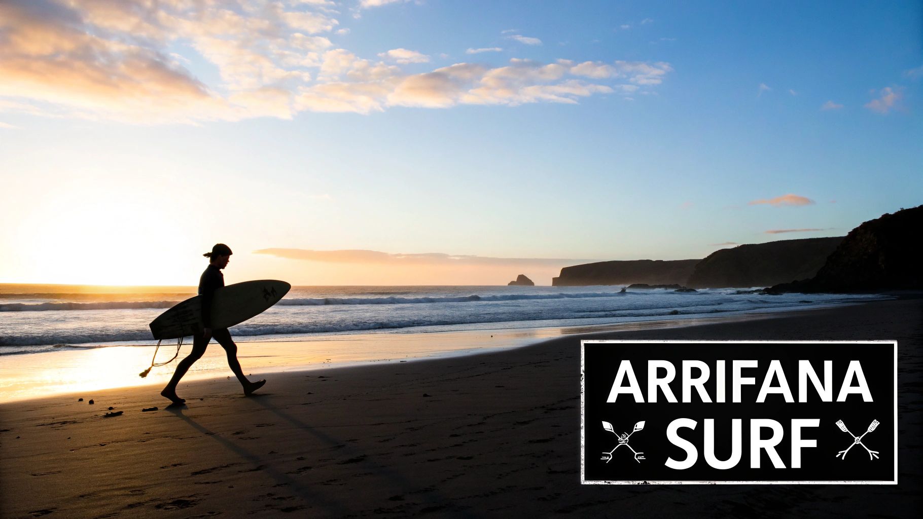 Silhouette of a surfer walking on Arrifana beach with a surfboard during sunset, waves, and cliffs.