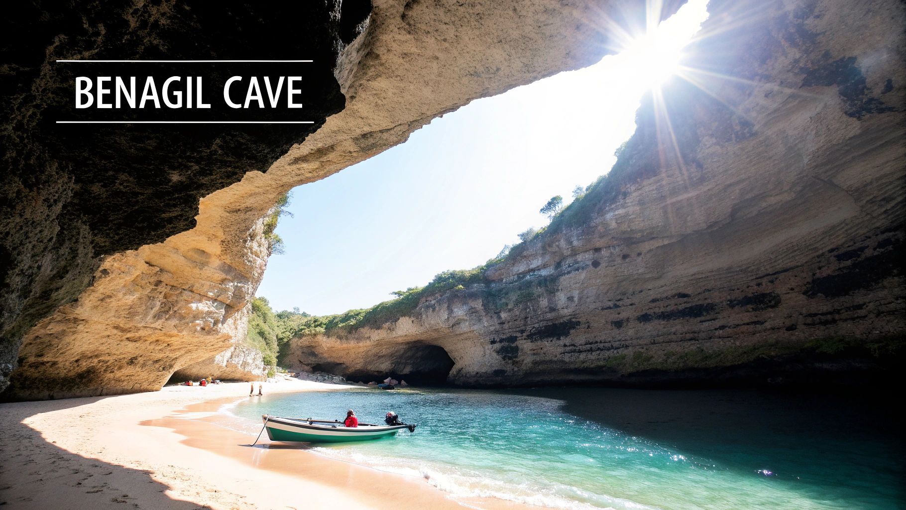 Benagil Cave interior with sunlight streaming through the top opening