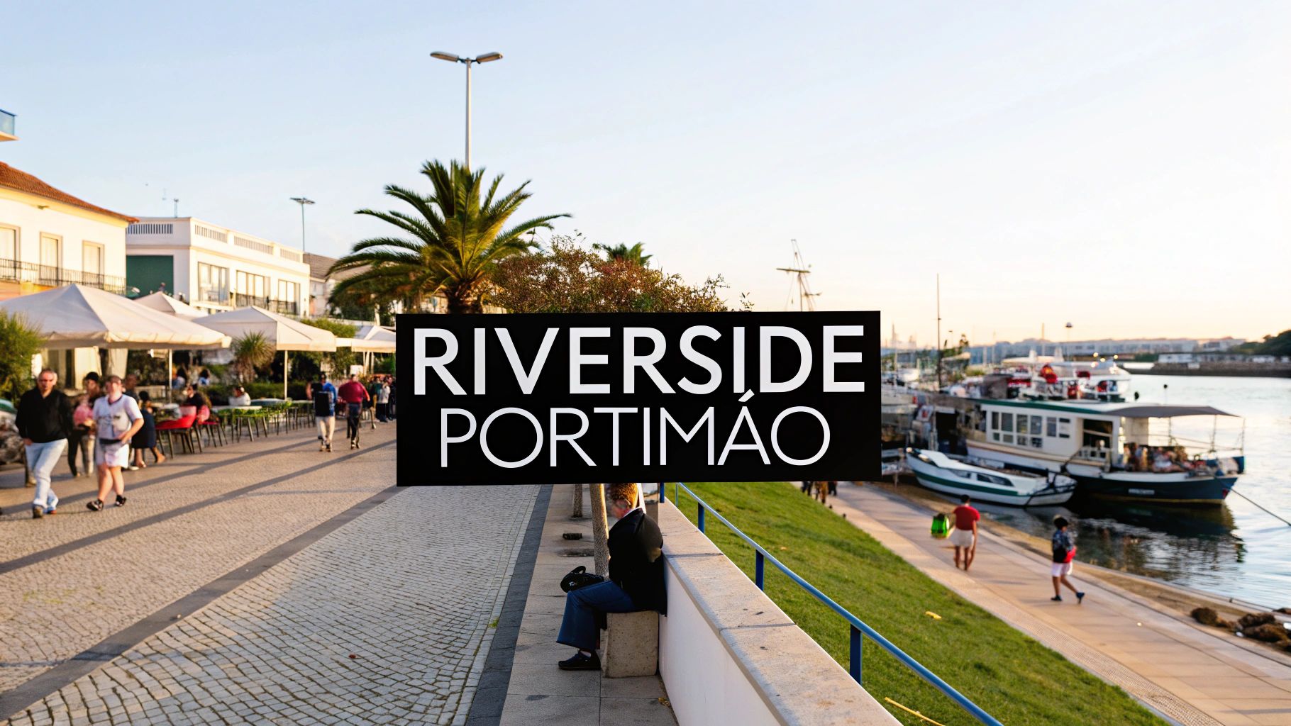 A lively riverside promenade in Portimão, Portugal, featuring cafes, people walking, and docked boats.