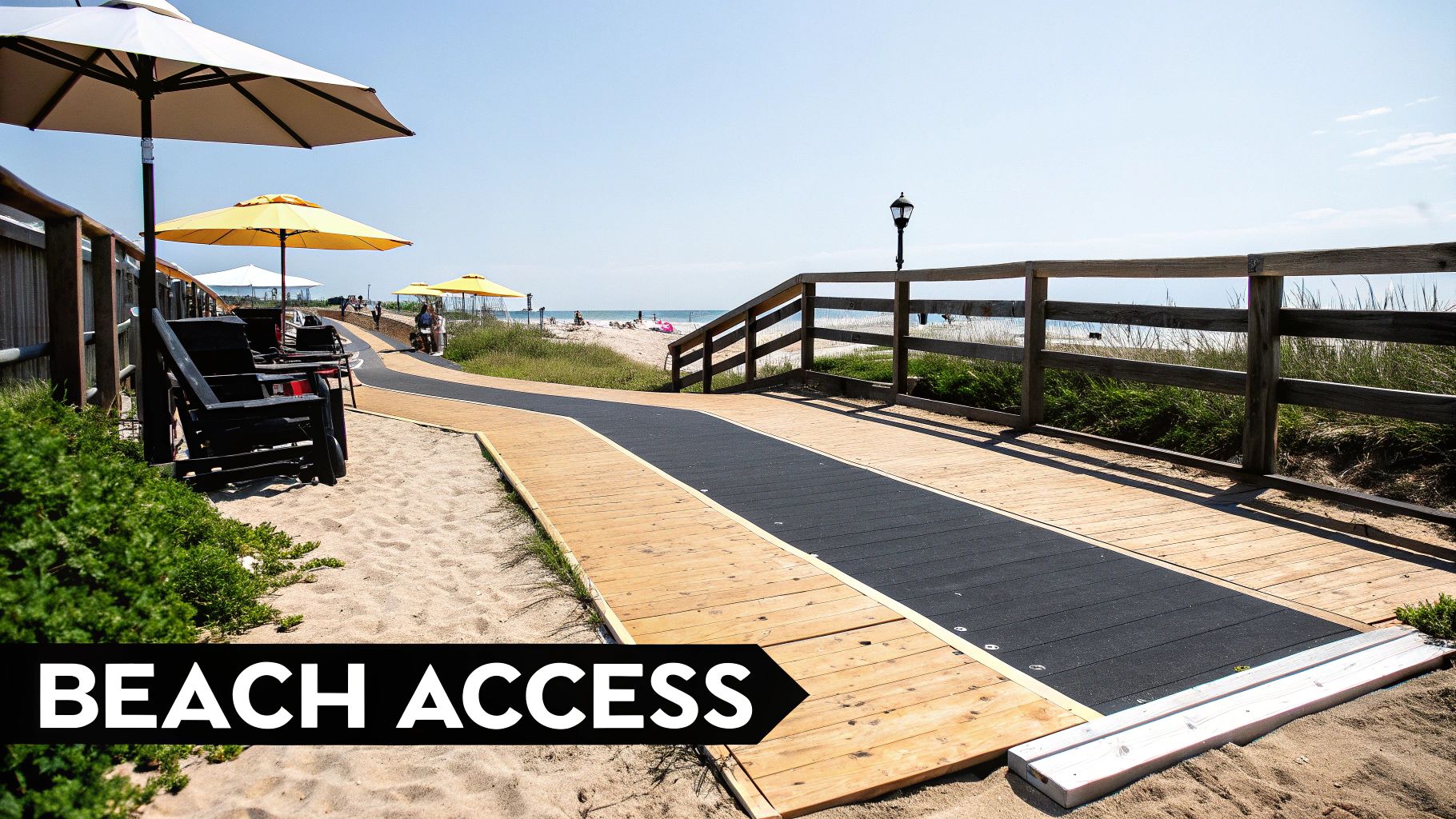 Wooden boardwalk and path provide accessible beach access with umbrellas, chairs, and people by the sea.