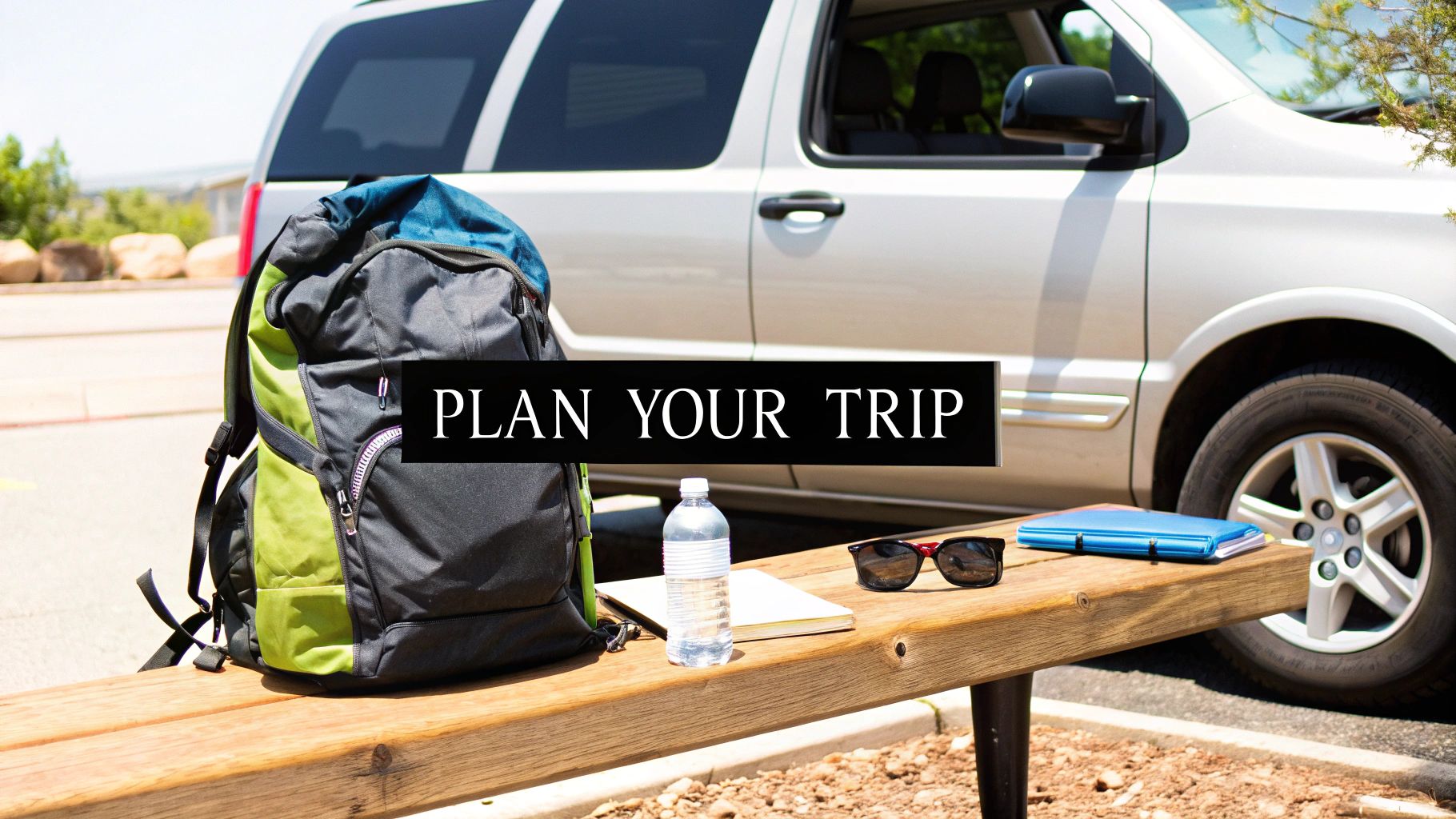 A backpack, water bottle, sunglasses, and notebook on a bench with an SUV and "PLAN YOUR TRIP" text.