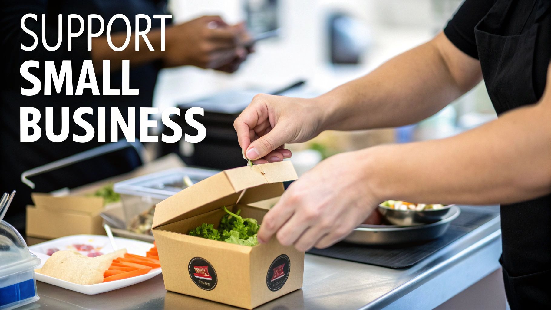 Hands pack a fresh salad into a brown takeout box on a counter, promoting small businesses.