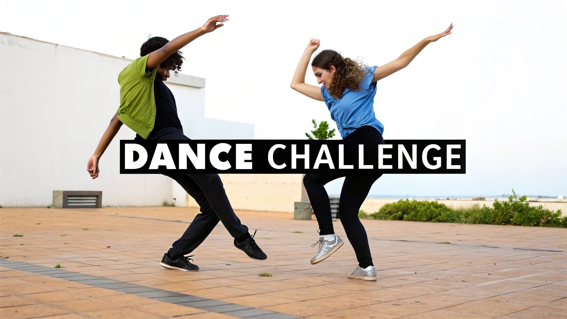 Two young dancers perform a dynamic outdoor "DANCE CHALLENGE" routine, arms outstretched.