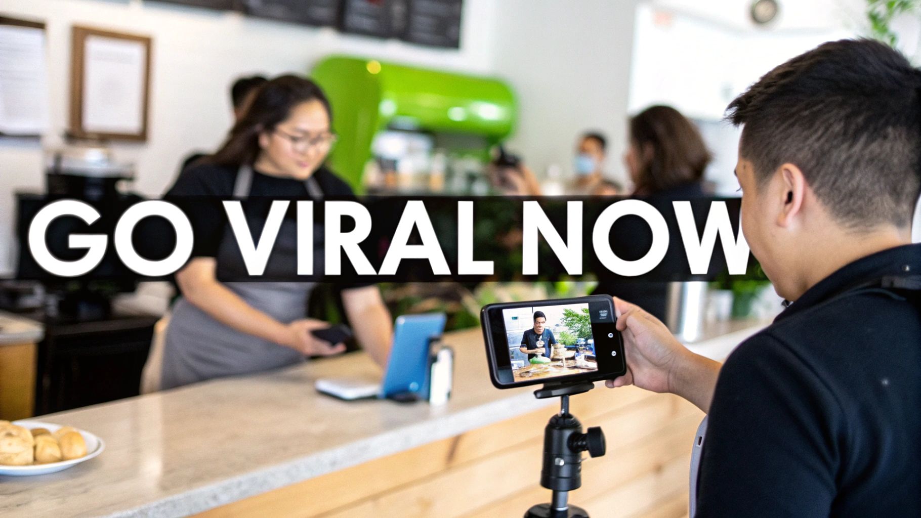 A person films content on a smartphone with a tripod in a modern cafe setting.