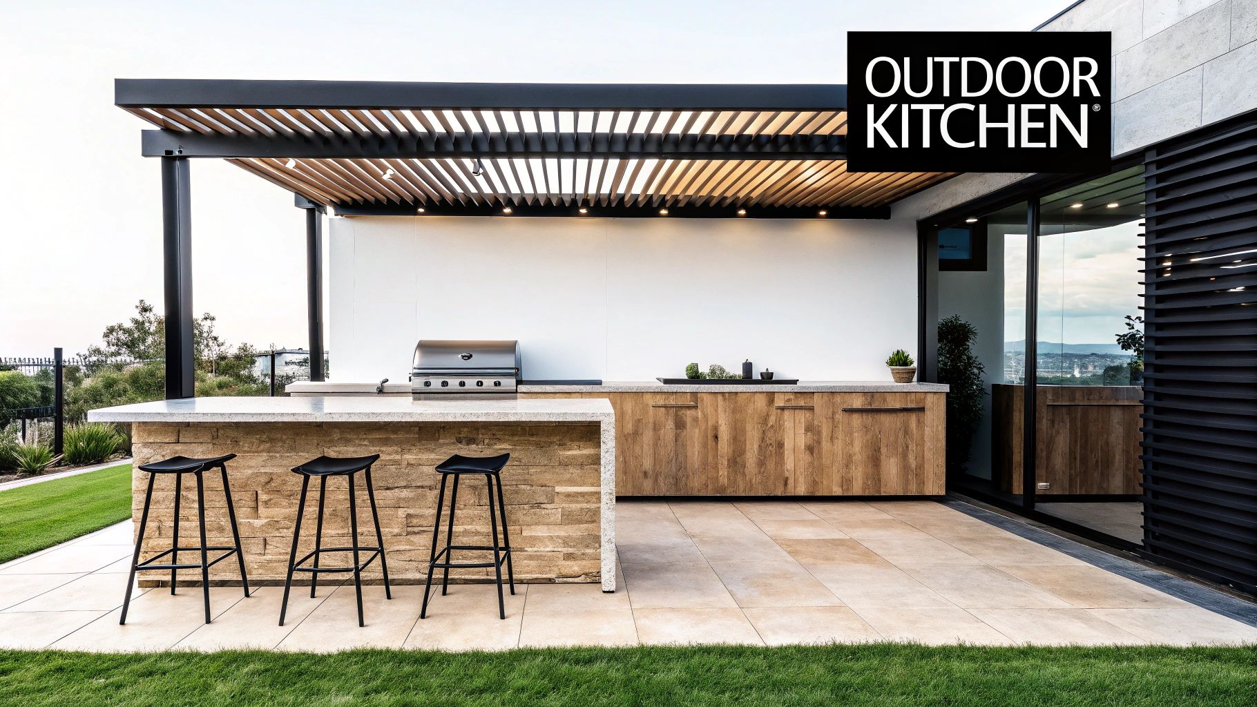 A luxurious outdoor kitchen featuring a built-in barbecue, modern wooden cabinets, stone bar, and a slatted pergola.