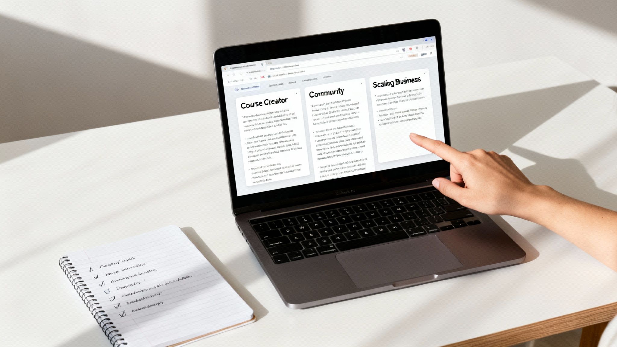 Person interacting with a laptop displaying a knowledge base interface, next to a notebook with a checklist.