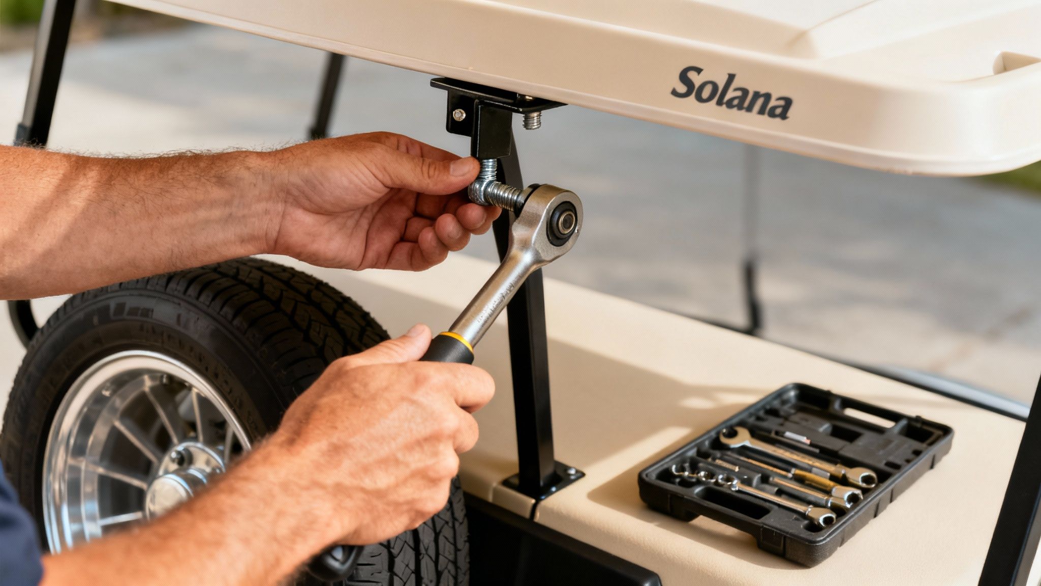 Hands tighten a bolt on a Solana golf cart roof support with a ratchet wrench, next to a toolbox.