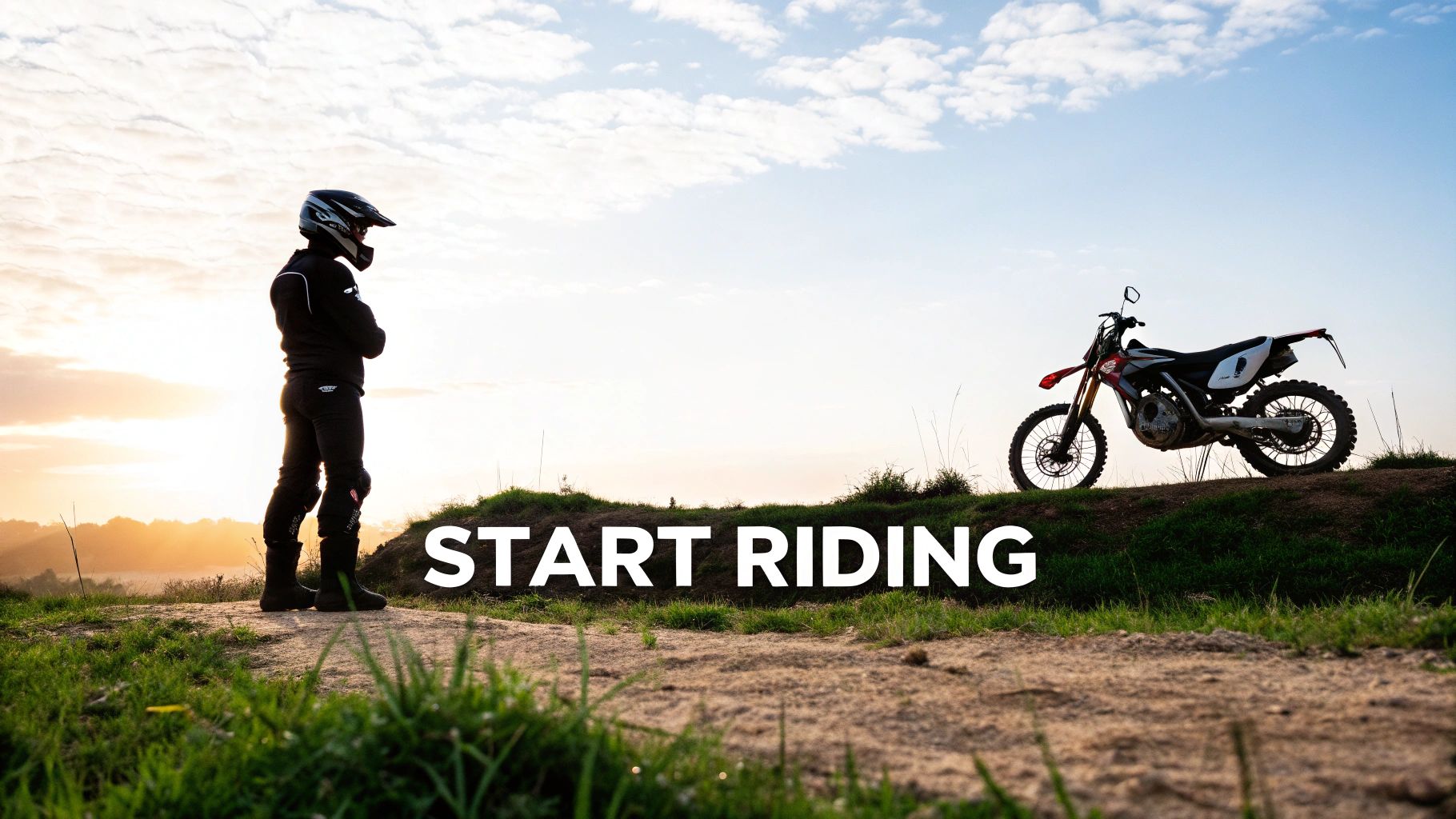 A rider in motocross gear stands looking at their dirt bike at sunrise with 'START RIDING' text.
