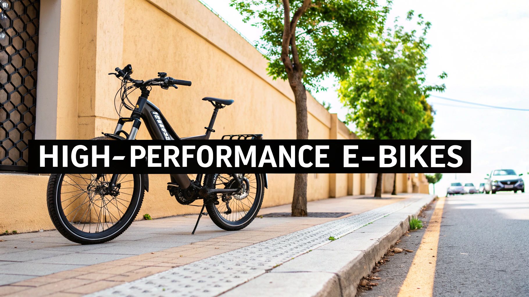 A high-performance black electric bike parked on a city sidewalk next to a beige wall and green trees.