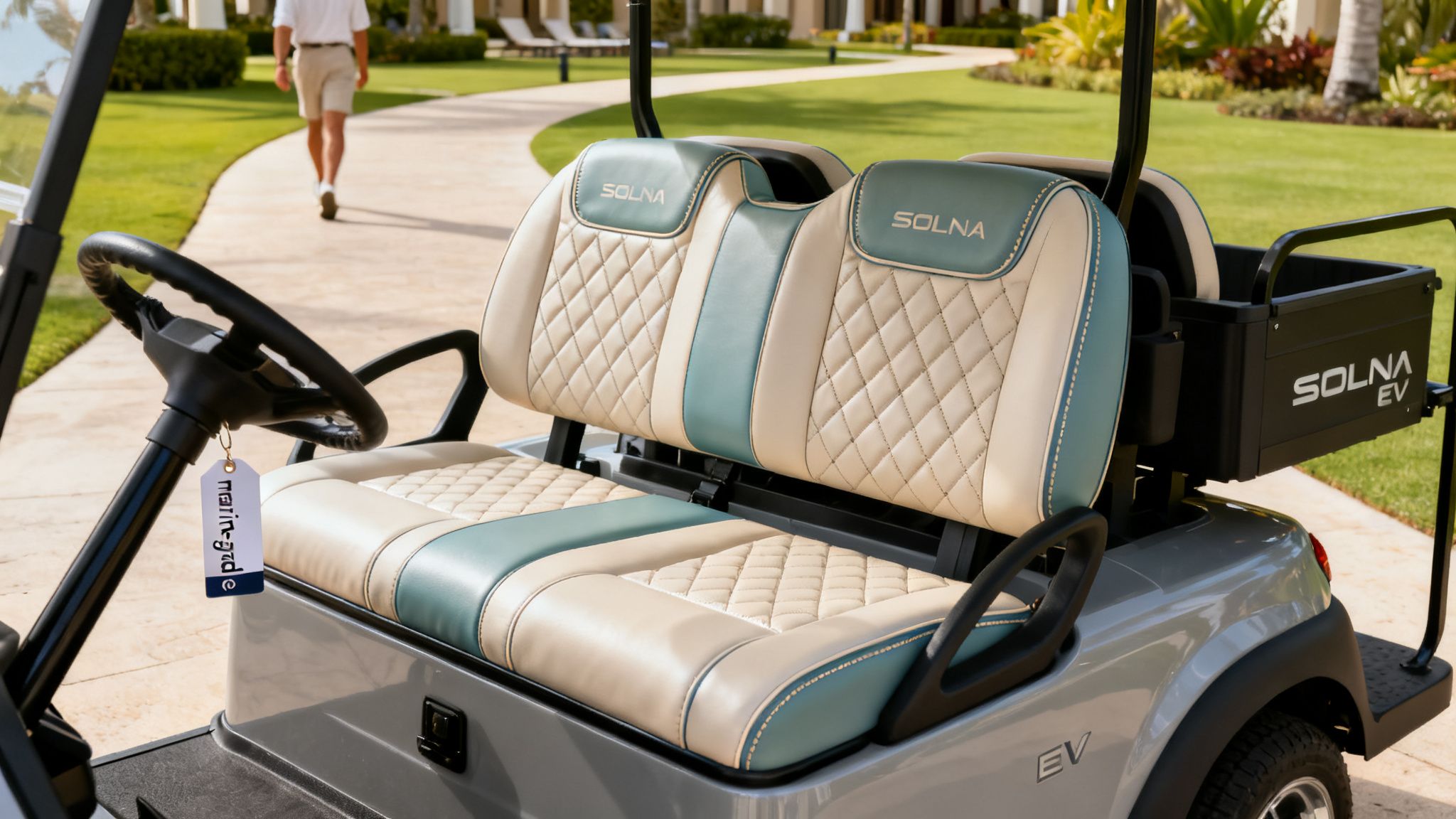 Close-up of luxurious, custom SOLNA golf cart seats with a beige and teal quilted design.