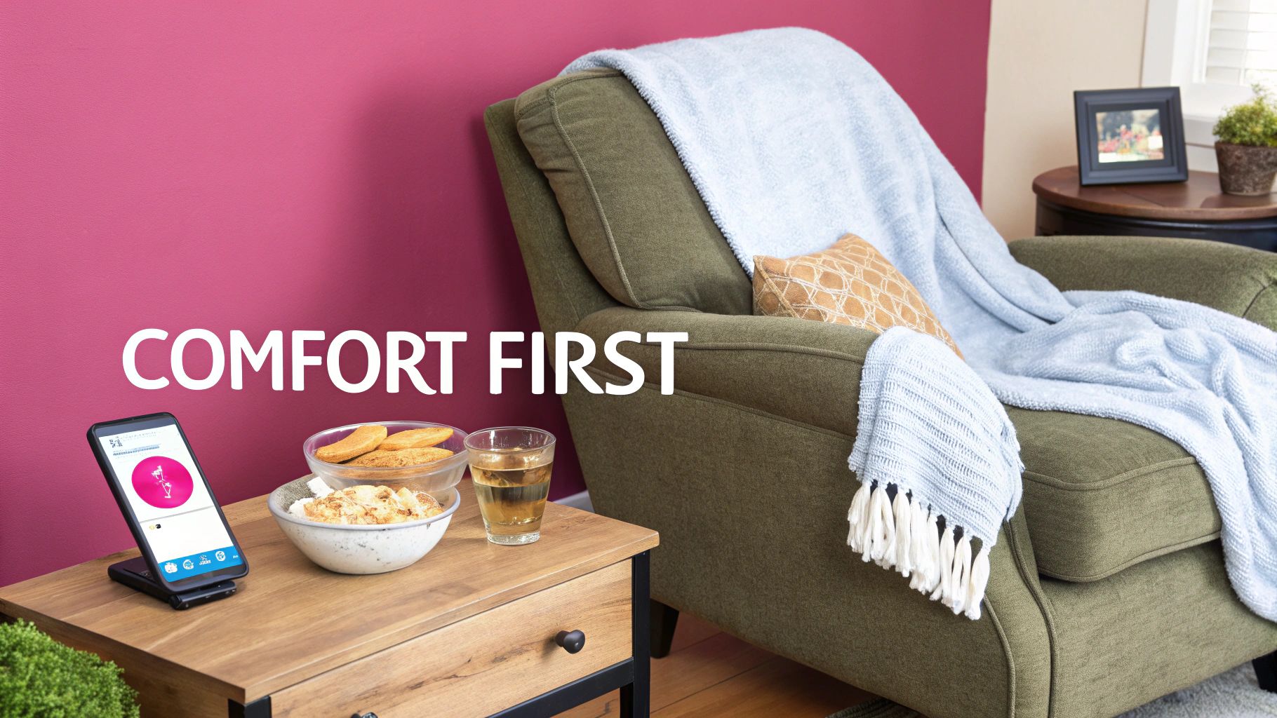 A cozy living room setup with a green armchair, a blue blanket, snacks, a drink, and a phone, with the text 'COMFORT FIRST' on the wall.