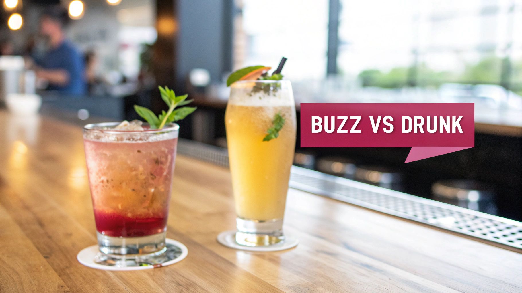Two vibrant cocktails, one reddish-pink and one yellow, on a wooden bar counter with a 'Buzz vs Drunk' overlay.