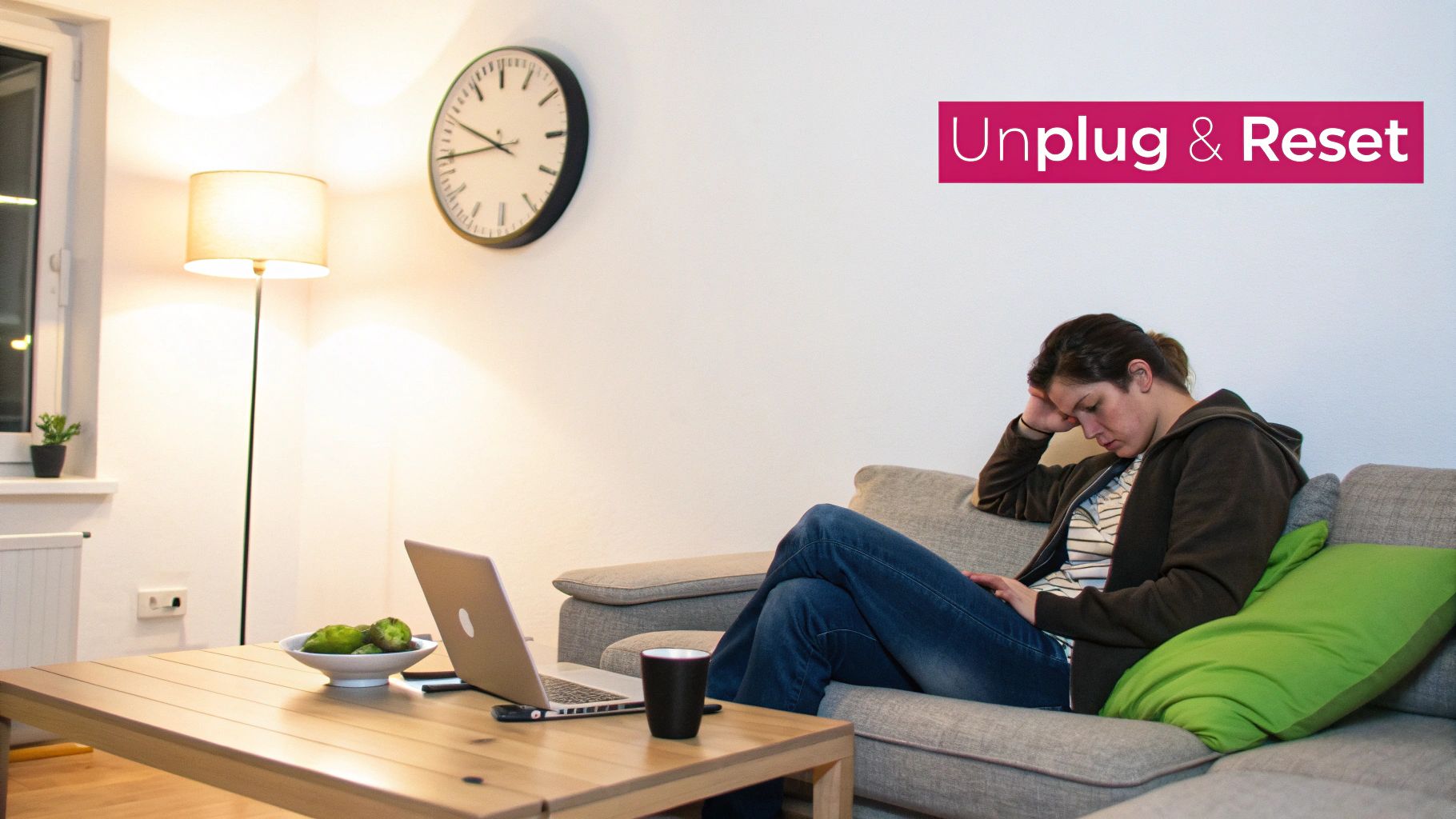 A tired woman on a couch, looking at her phone, with a laptop and 'Unplug & Reset' text.