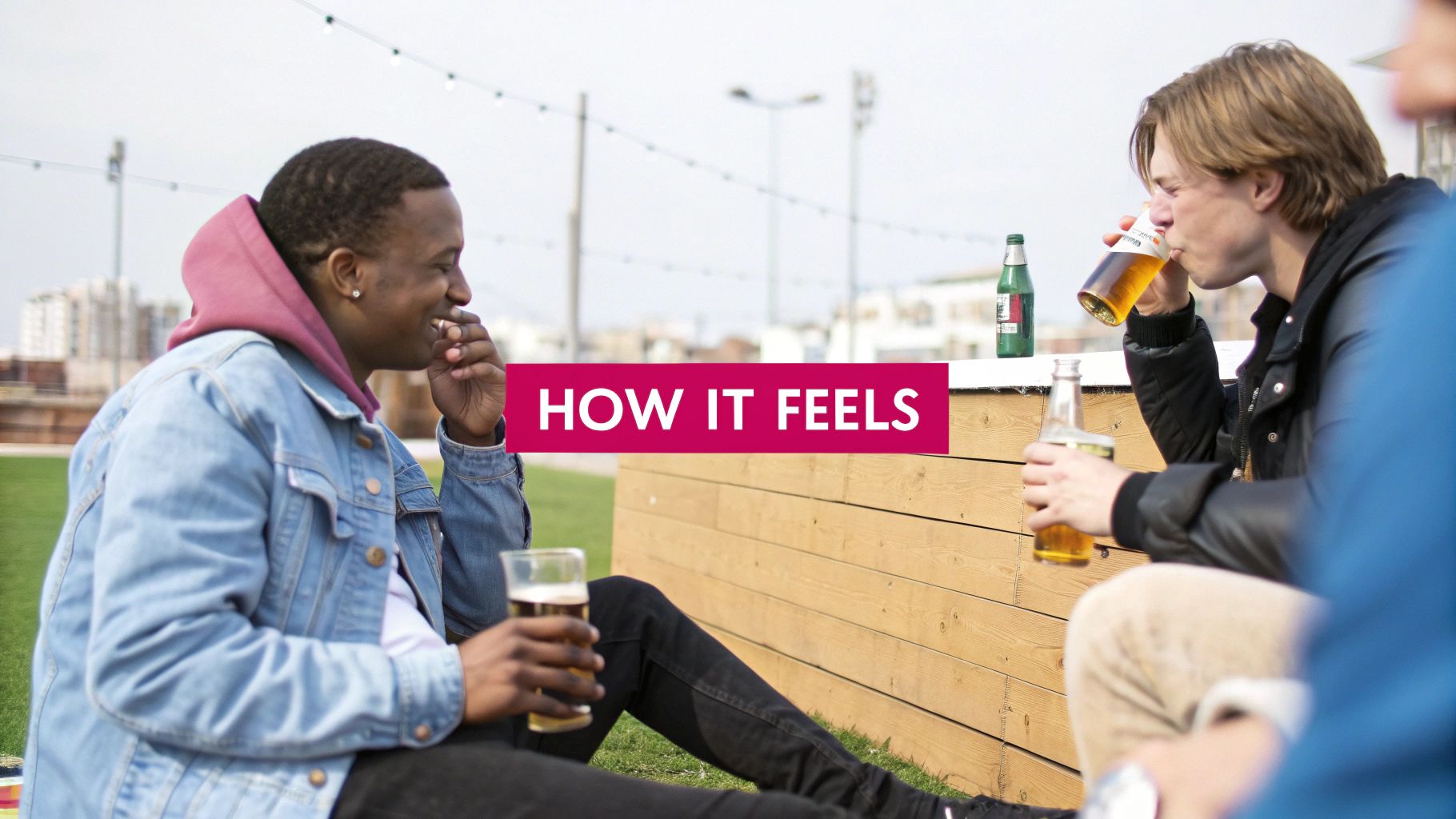 Two young men enjoying beers outdoors, one smiling and holding a glass, the other drinking from a bottle.