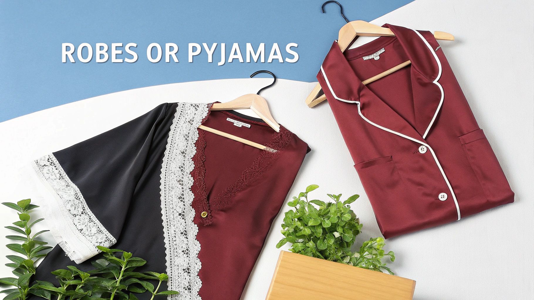 Elegant burgundy satin pajama top and a black lace-trimmed robe on hangers, with plants.