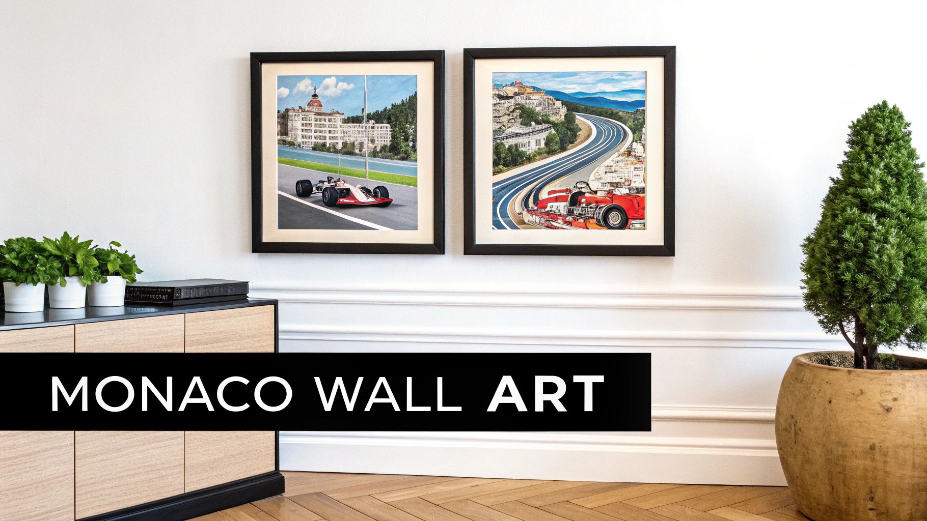Two framed artworks of Monaco Grand Prix scenes on a white wall above a wooden cabinet with plants.