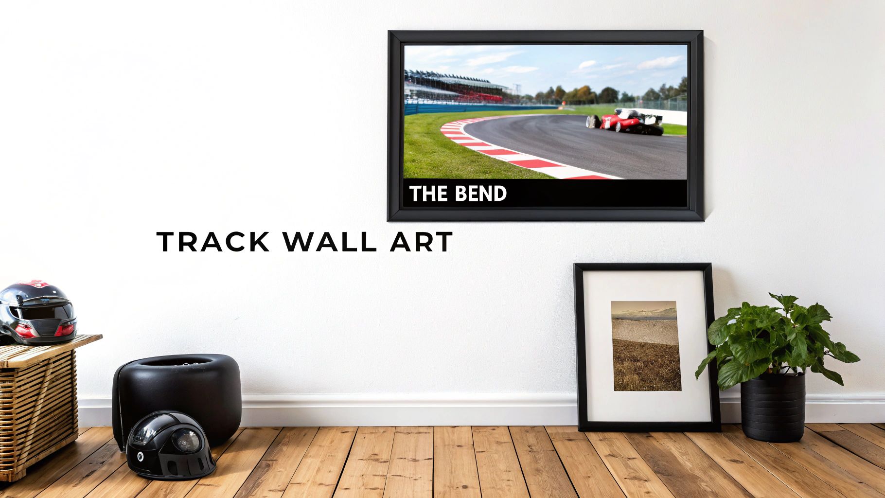 A room with white walls and wooden floors featuring a framed race track art print and motorsport decor.