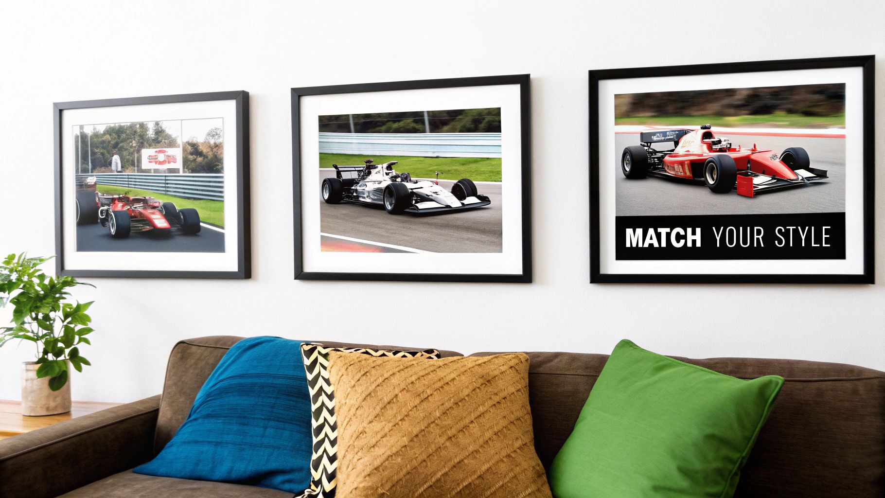 Three framed Formula 1 race car prints displayed on a white wall above a brown couch with colorful pillows.