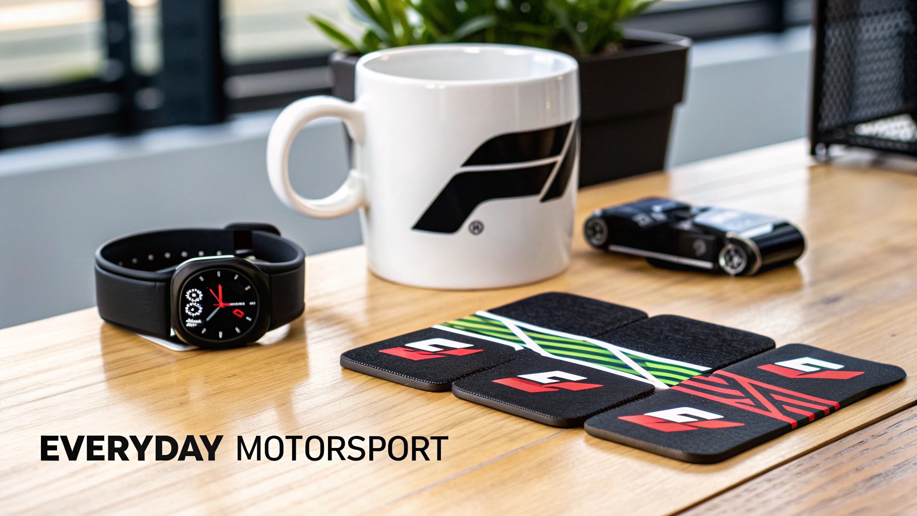 A collection of F1-themed gifts and accessories on a desk, promoting everyday motorsport.