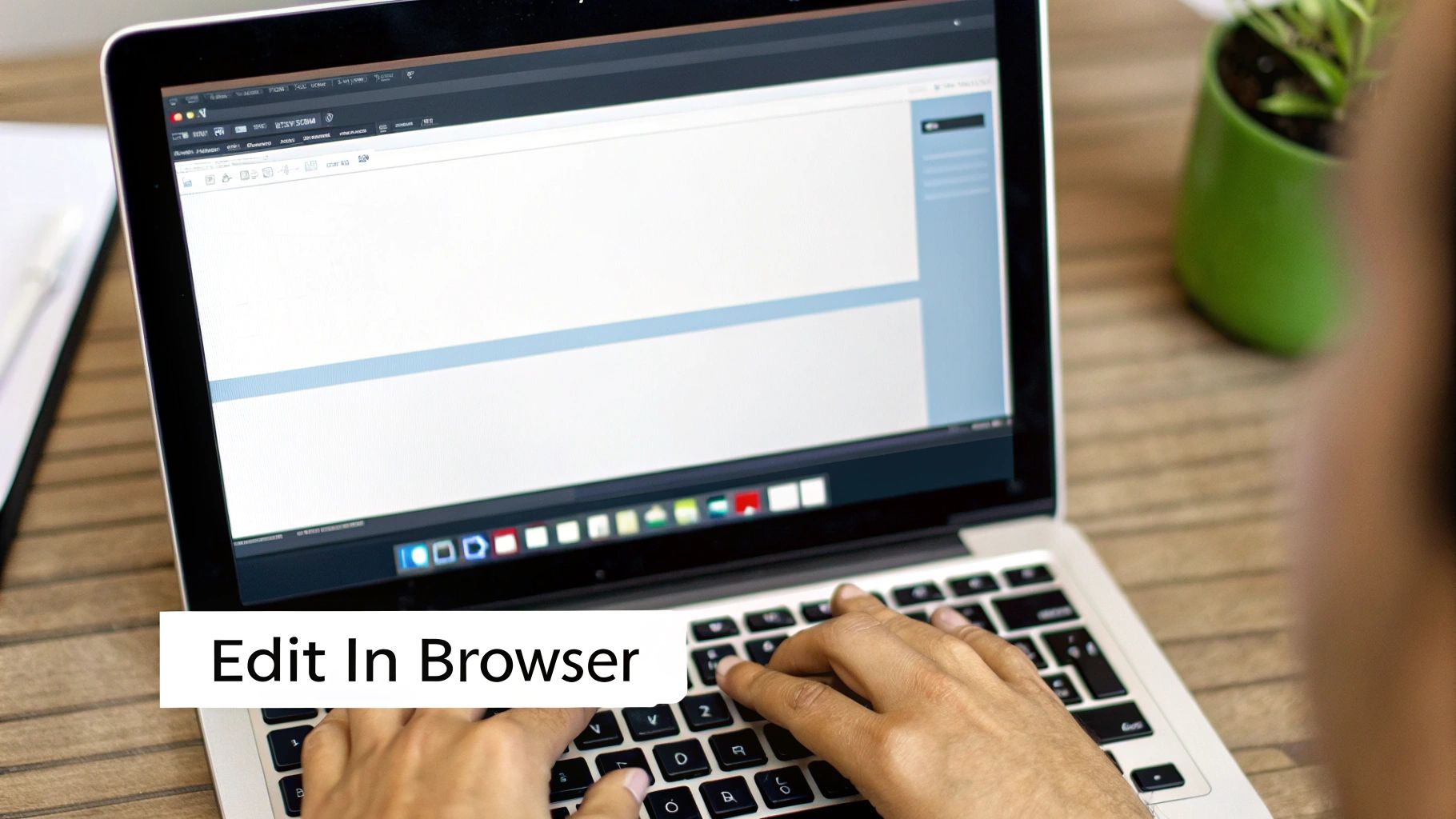A person's hands are typing on a laptop keyboard, working on a document within a browser editor.