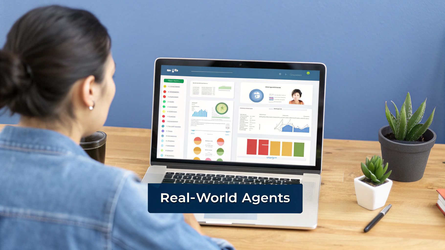 Rear view of a person looking at a laptop with a data analytics dashboard and 'Real-World Agents' text.