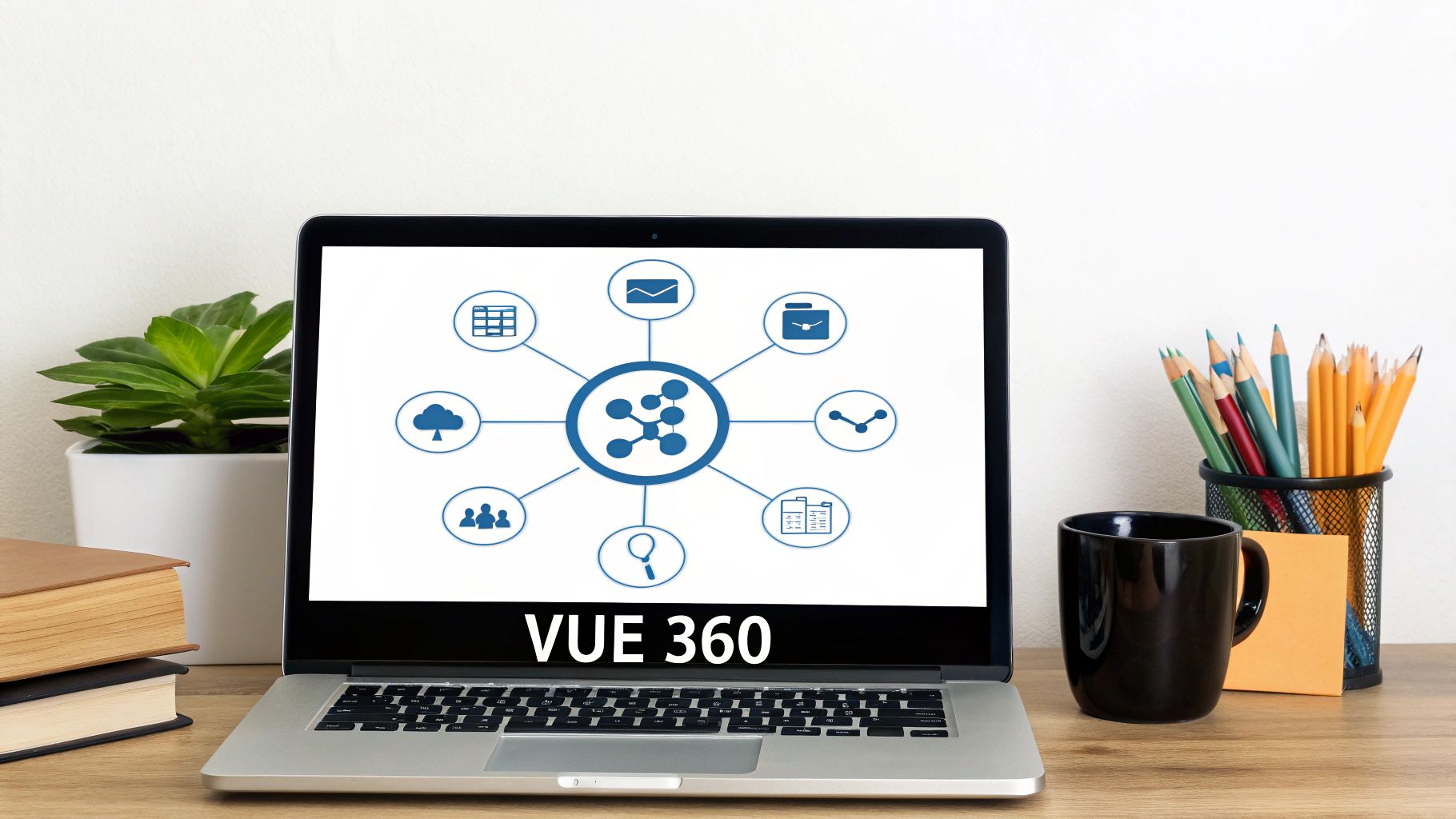 Ordinateur portable affichant un tableau de bord VUE 360 avec divers icônes de gestion, posé sur un bureau en bois.