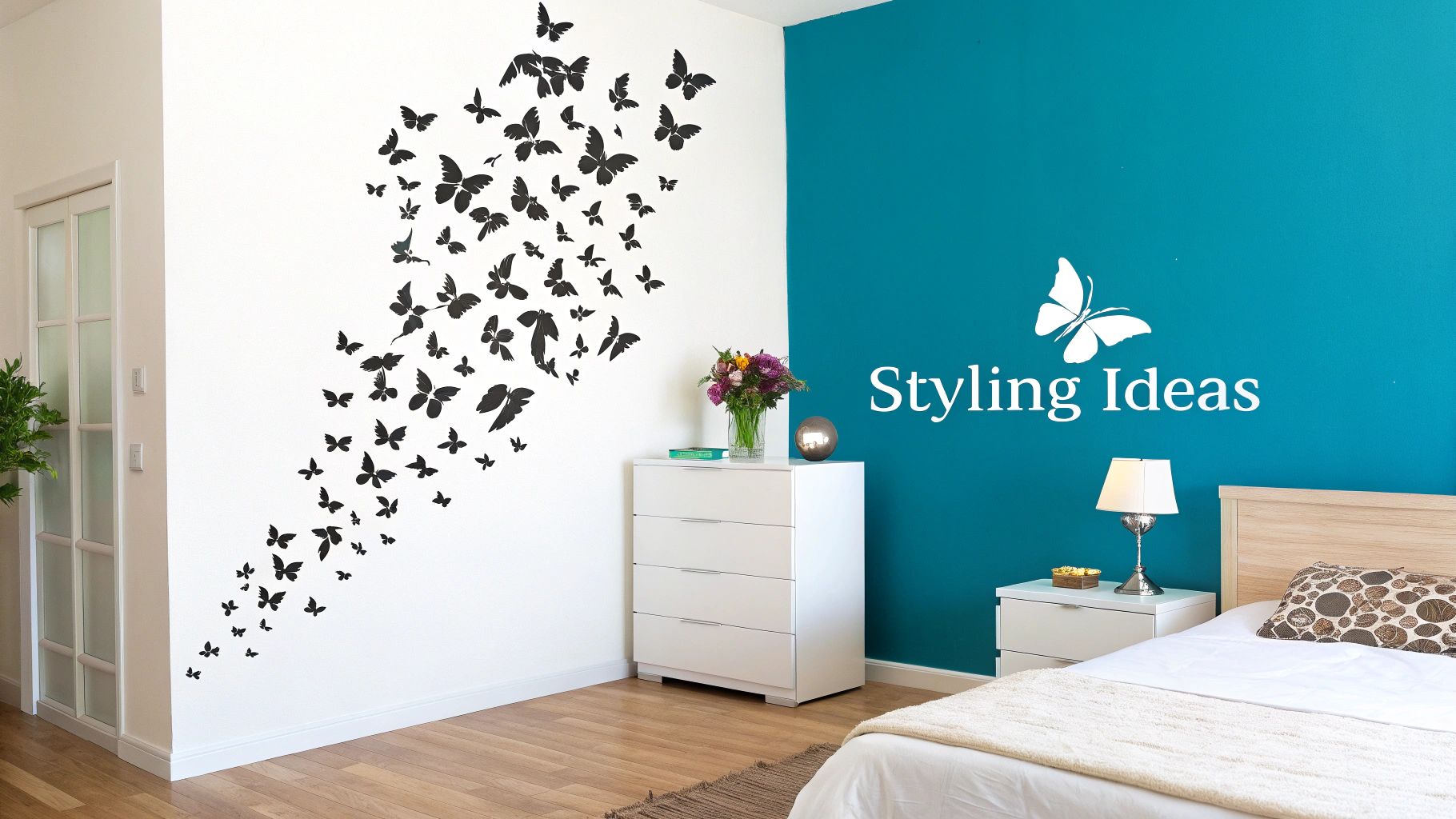 A room with a white wall adorned with black butterfly decals and a teal wall featuring 'Styling Ideas' text and a white butterfly graphic. A bed with a wooden headboard, a white dresser, and a nightstand are visible.