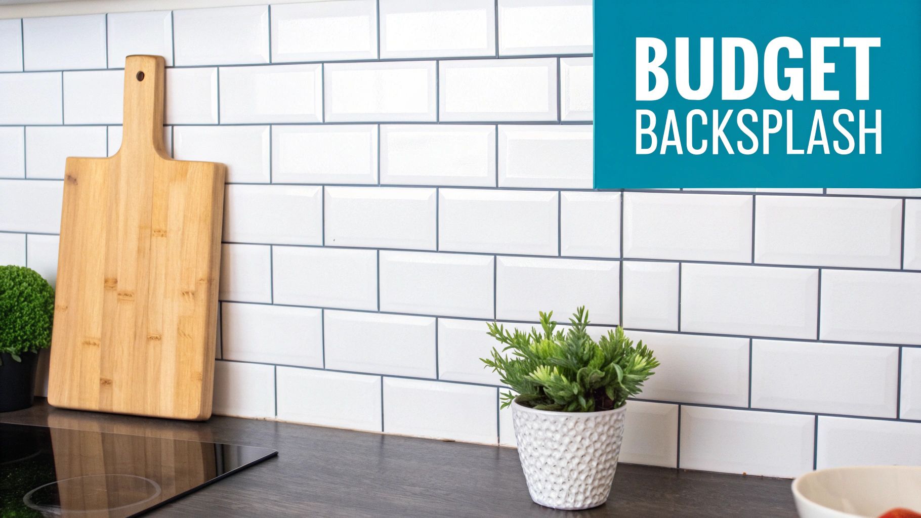 A modern kitchen with white subway tile backsplash, a wooden cutting board, and potted plants.