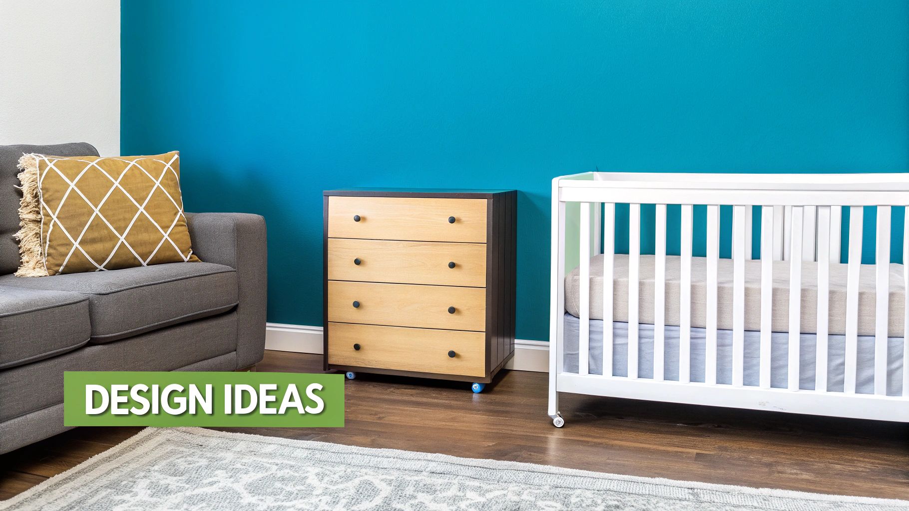 A modern room with a teal wall, grey sofa, wooden dresser, and white crib on a patterned rug.