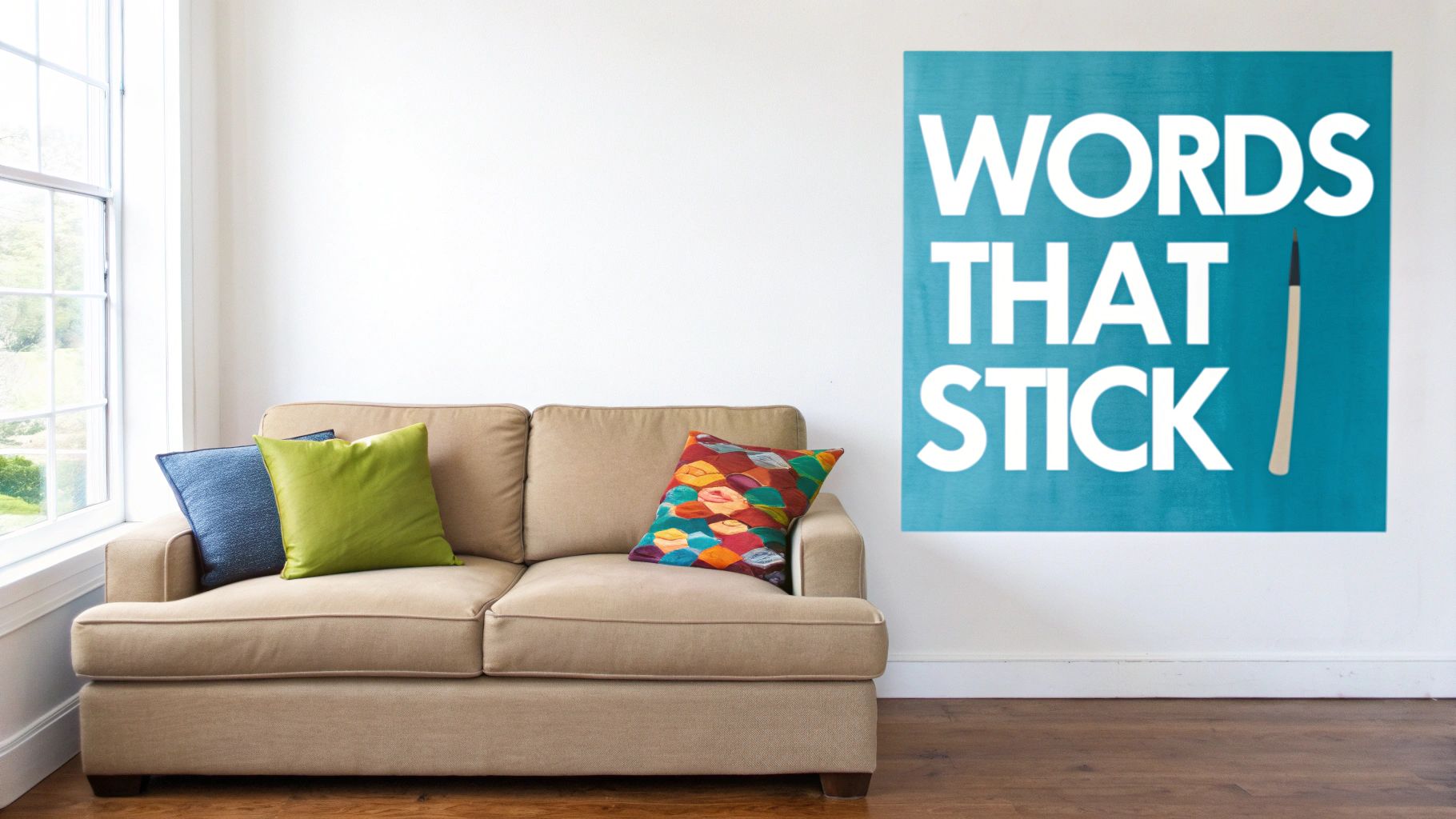 A cozy living room with a beige sofa, colorful pillows, and a blue wall sticker reading 'WORDS THAT STICK'.