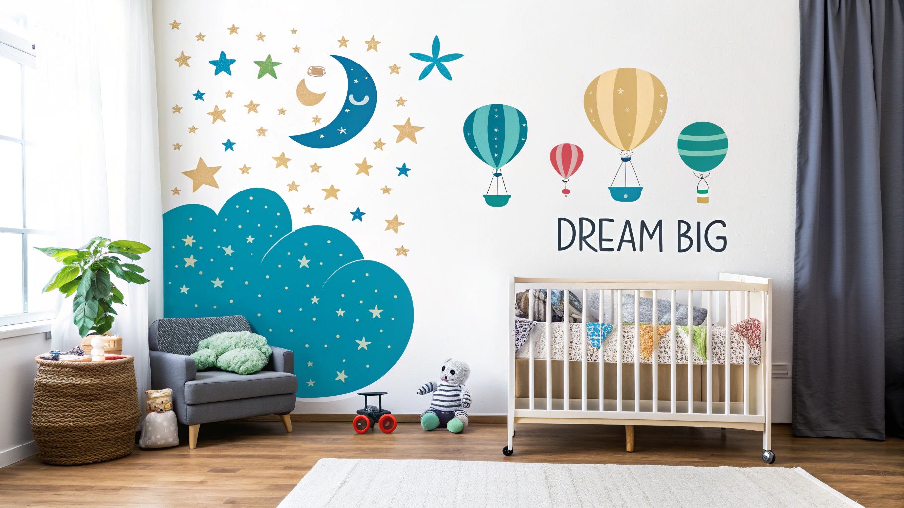 A children's nursery featuring "Dream Big" hot air balloon and starry night wall decals above a crib.