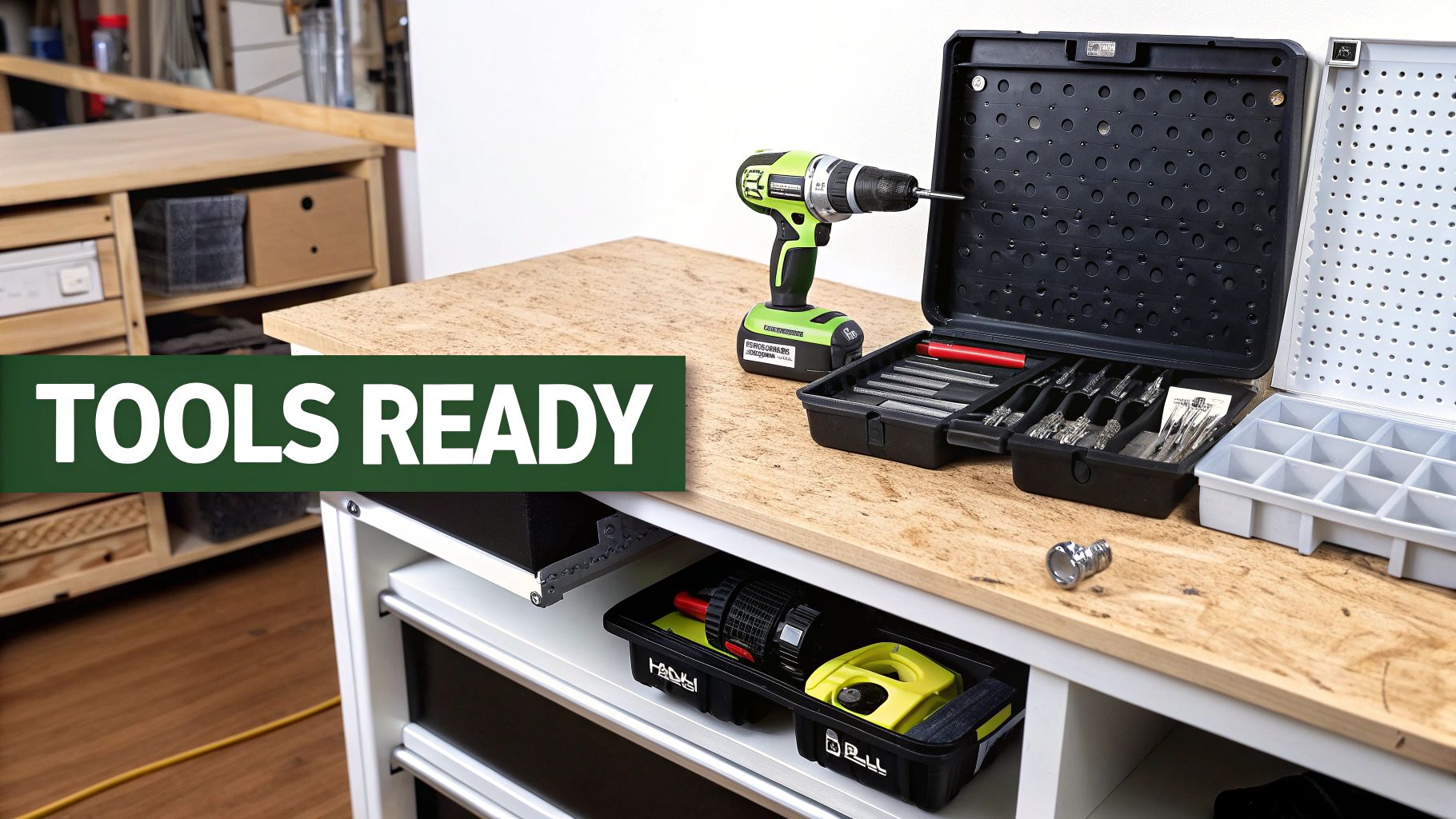 A workshop bench with a cordless drill, drill bit set, and tool organizers ready for use.