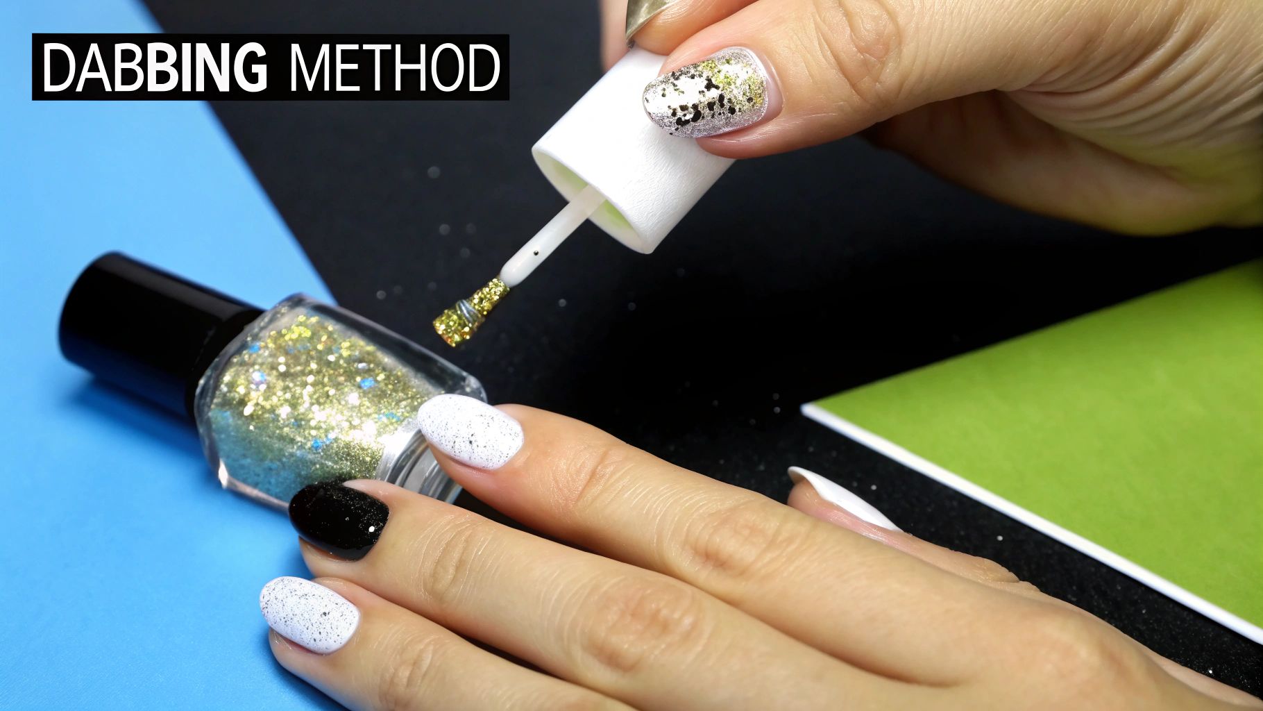 A close-up of a person using a makeup sponge to dab glitter nail polish onto their nail.