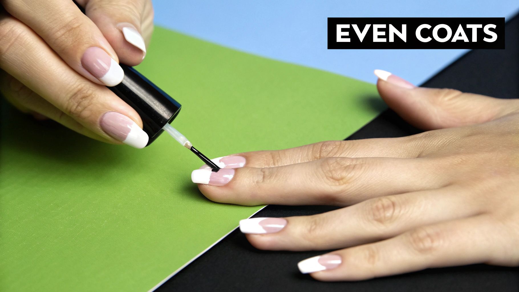 Close-up of a person carefully applying a thin coat of nail polish.