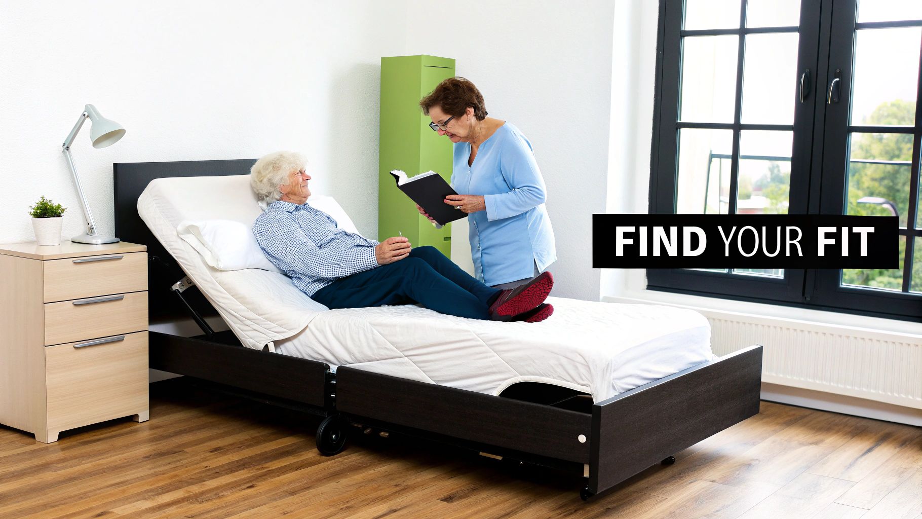 An elderly woman reads a book to another elderly woman relaxing on an adjustable bed in a bright room.