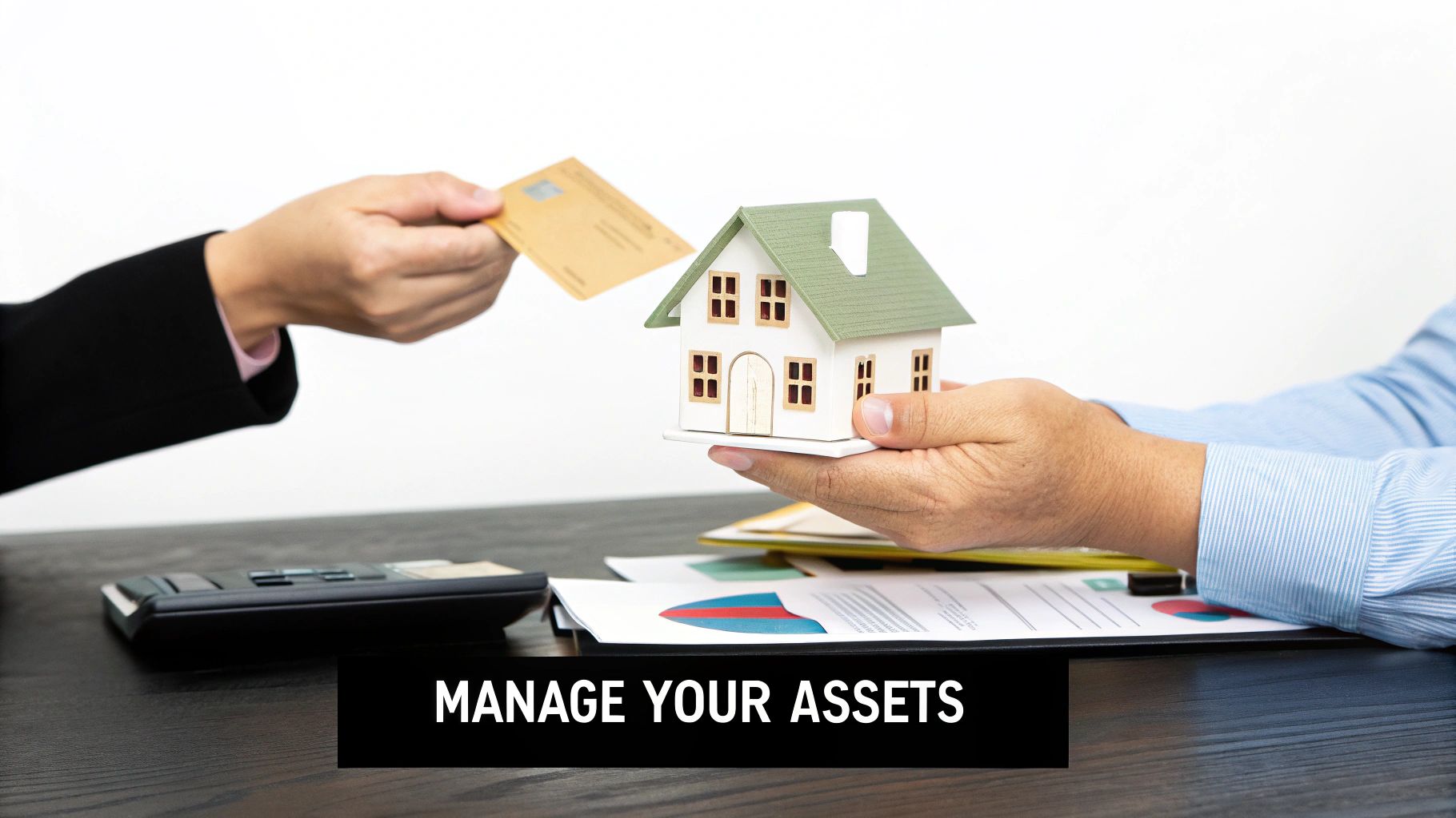 Hands exchanging a credit card for a house model, with financial documents and a calculator on a desk.