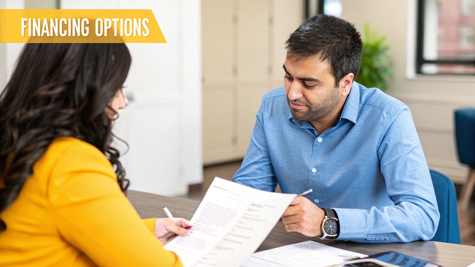 Person reviewing financial documents for a property purchase