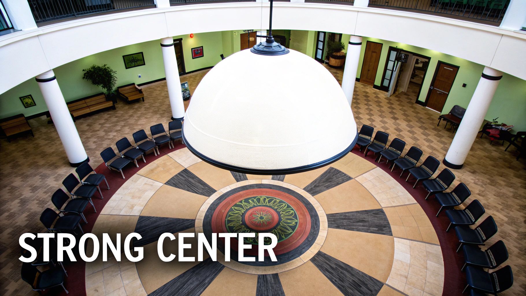 Aerial view of Strong Center atrium featuring radial balance design with circular floor pattern and chairs