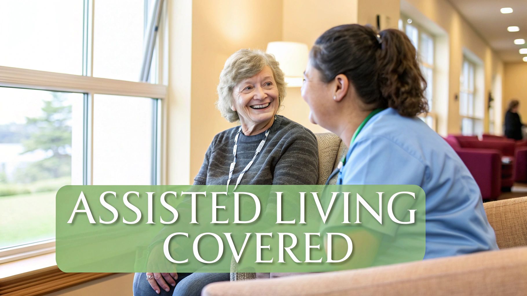 An elderly woman smiling and talking with a caregiver in an assisted living facility.