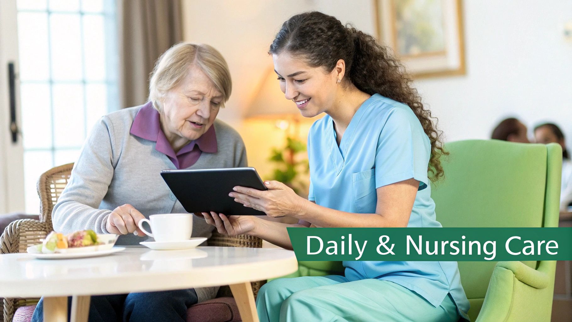 A smiling caregiver in scrubs helps an elderly woman look at a tablet during a daily care session.