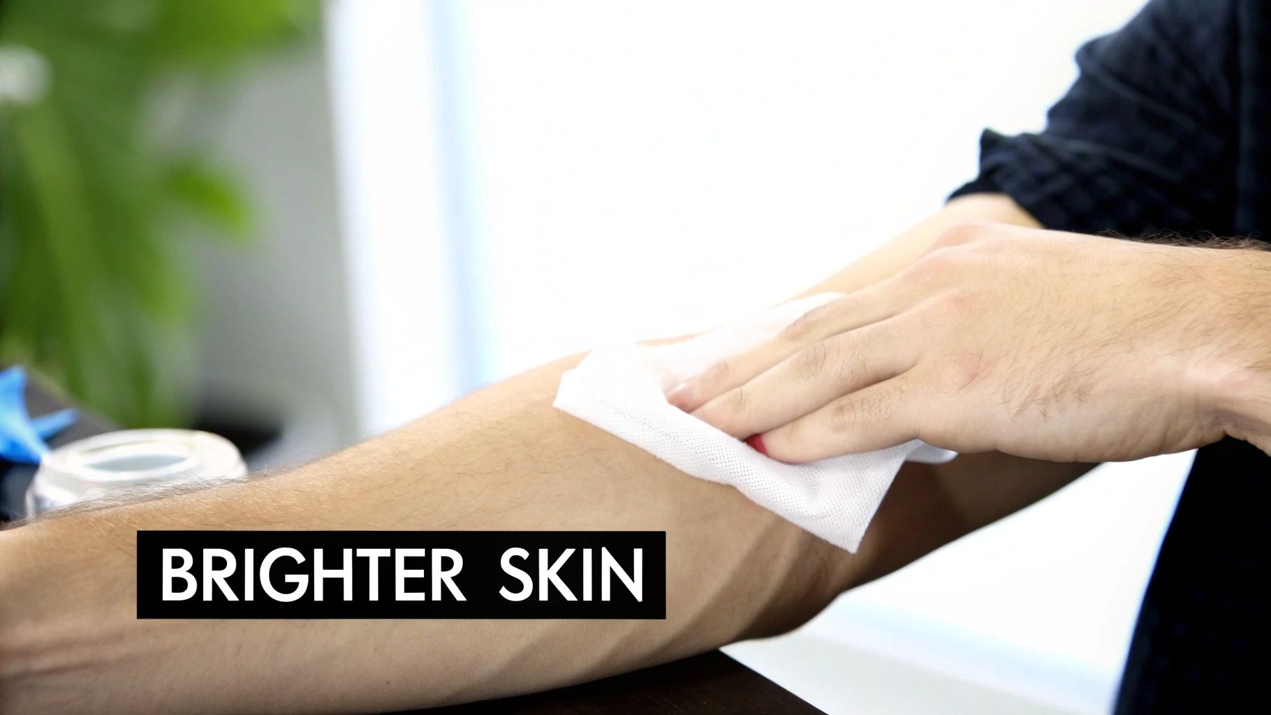 A person's arm being wiped with a white cloth, revealing a small red mark and text 'BRIGHTER SKIN'.