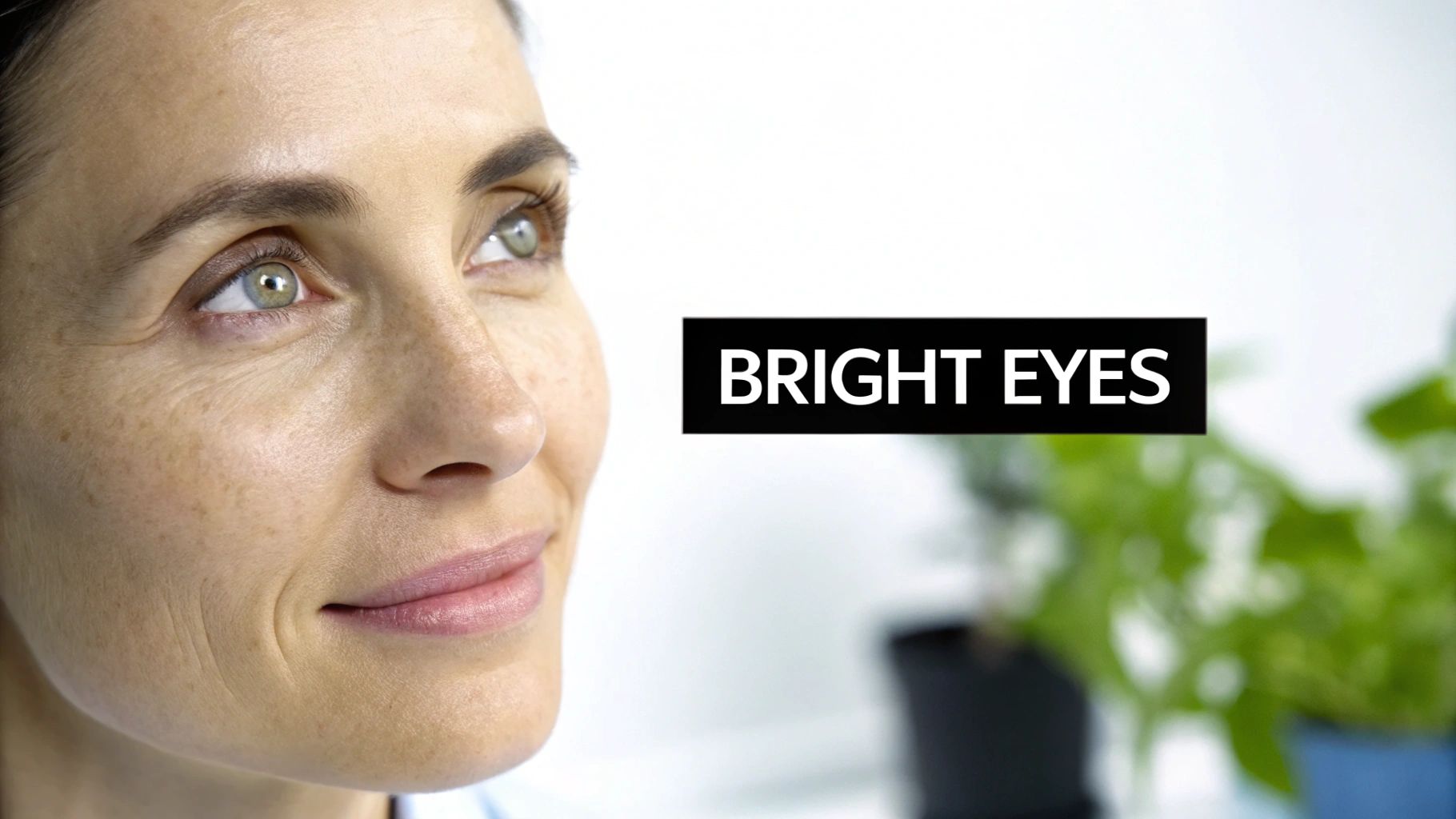 Close-up of a smiling woman's face with bright green eyes and natural skin. Text says 'BRIGHT EYES'.