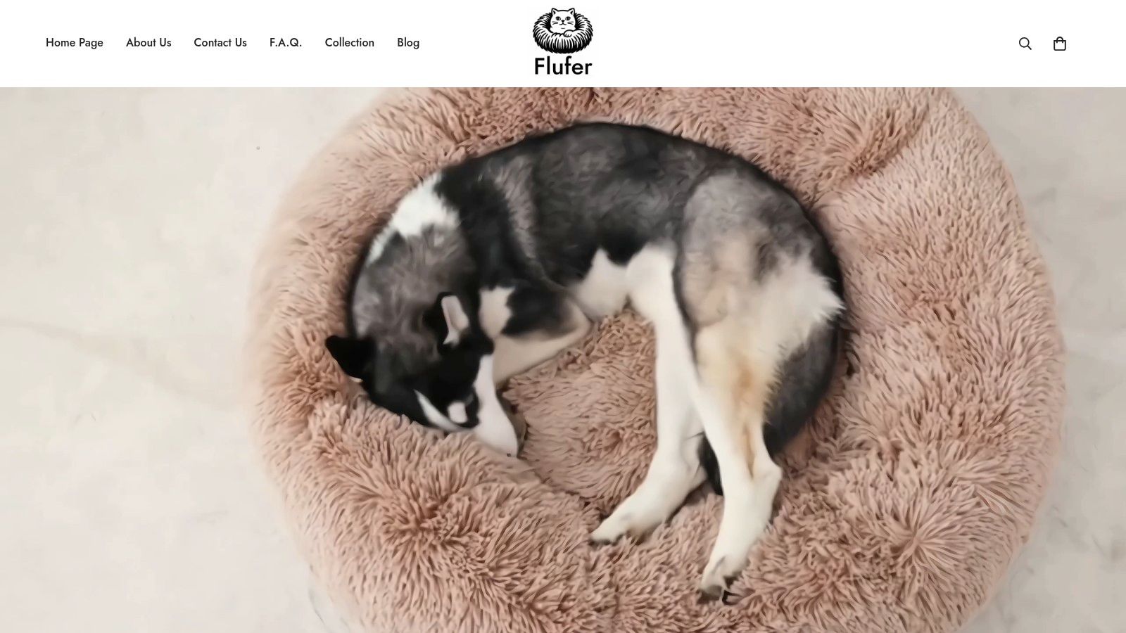 A fluffy, gray, nest-like pet bed from Flufer Store, showcasing its soft texture and calming design.